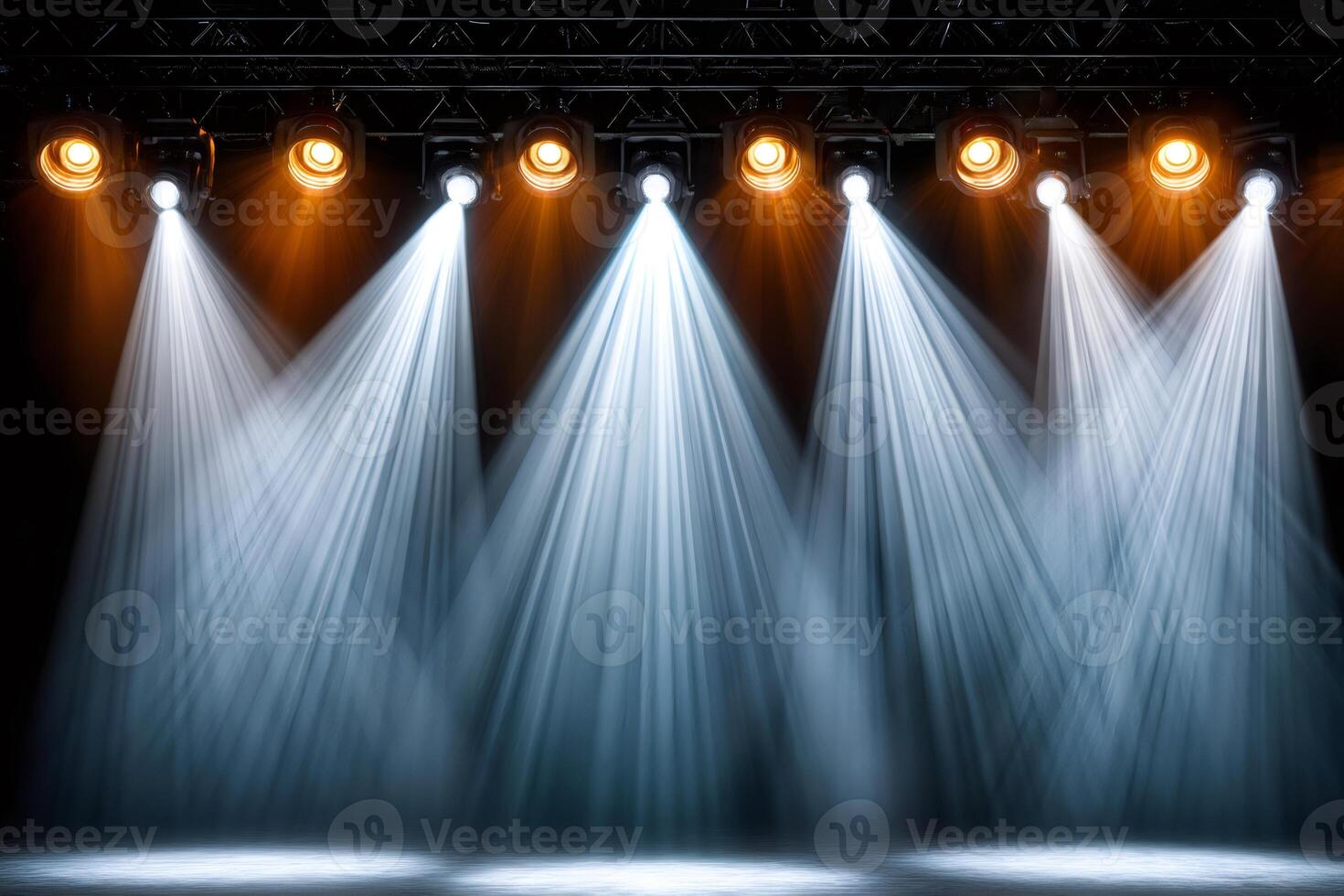 Bright stage lights illuminating empty stage for show performance photo