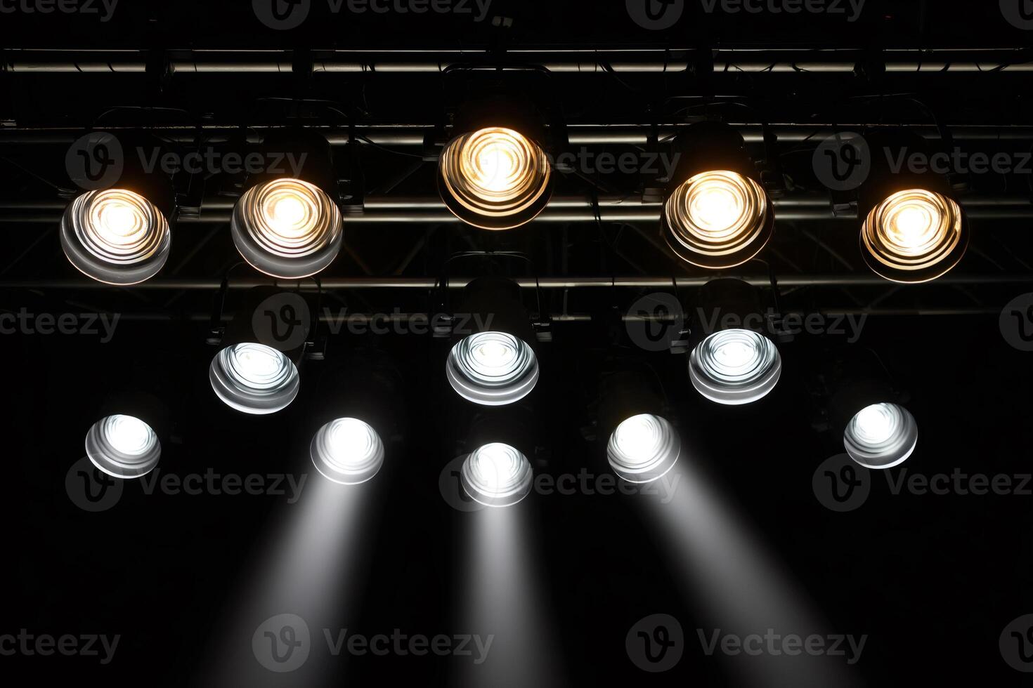 Stage lights illuminating empty stage in theater photo