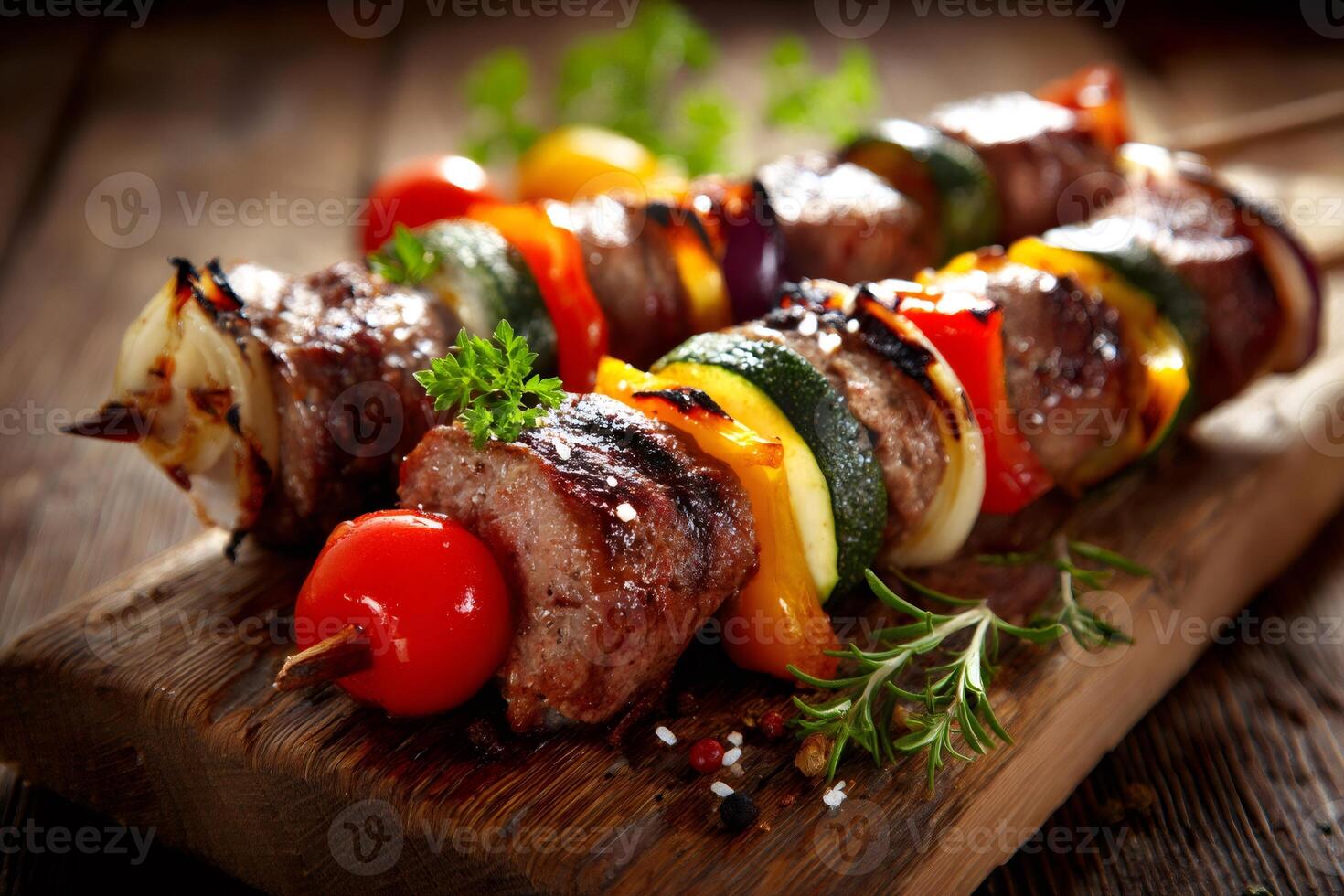 Grilled meat and vegetable skewers resting on rustic wooden cutting board photo