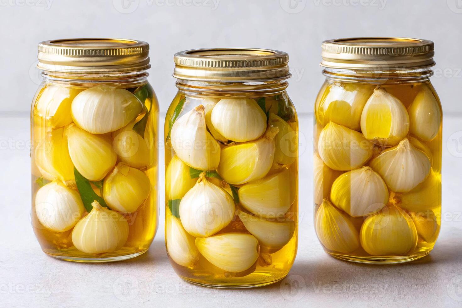 Preserving fresh garlic cloves in oil with herbs photo