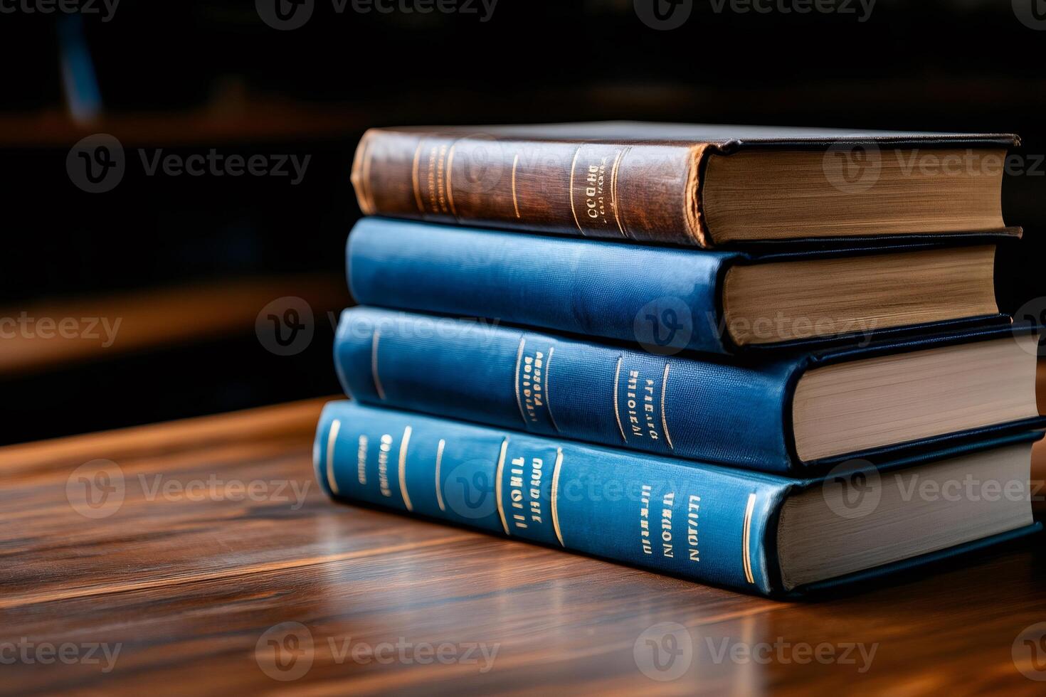 Stack of old books resting on wooden table in library setting photo