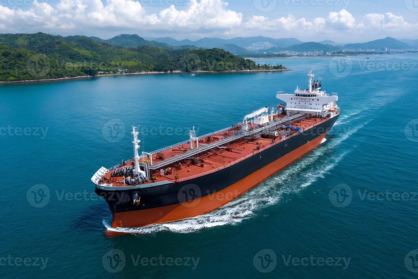 Large oil tanker ship sailing in the ocean near tropical islands photo