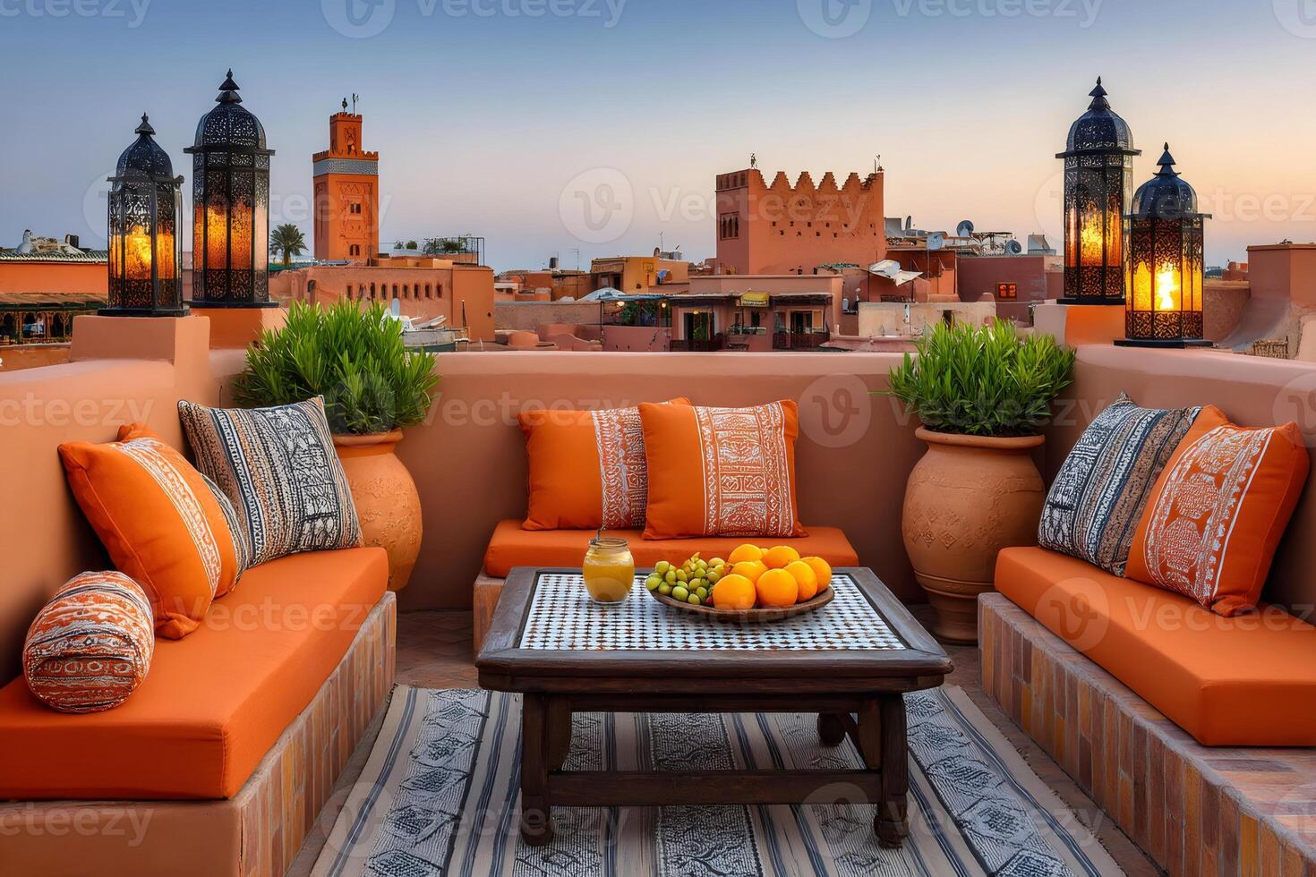 Rooftop terrace overlooking marrakech medina at sunset with lanterns and fresh fruit photo