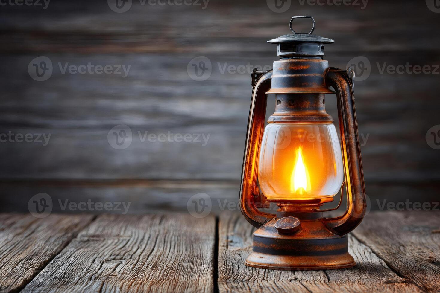 Burning oil lamp illuminating rustic wooden table in moody setting photo
