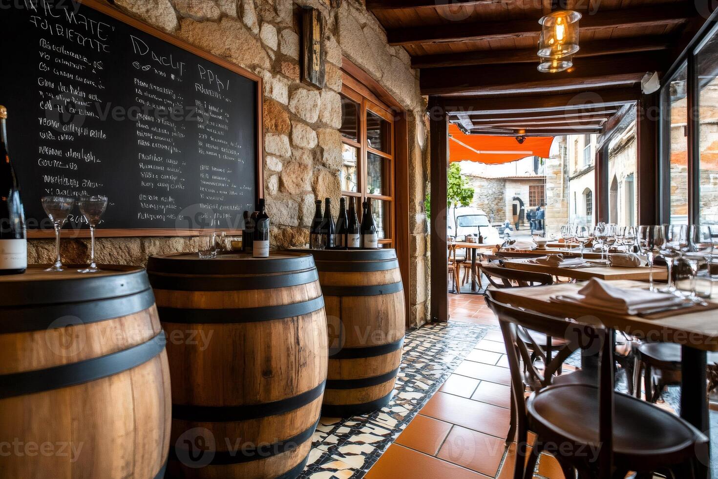 Wine bar interior with chalkboard menu and barrels displaying wine bottles photo