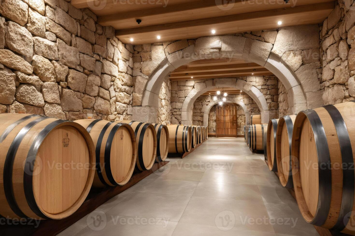 Oak wine barrels resting in a traditional cellar, representing the winemaking process photo