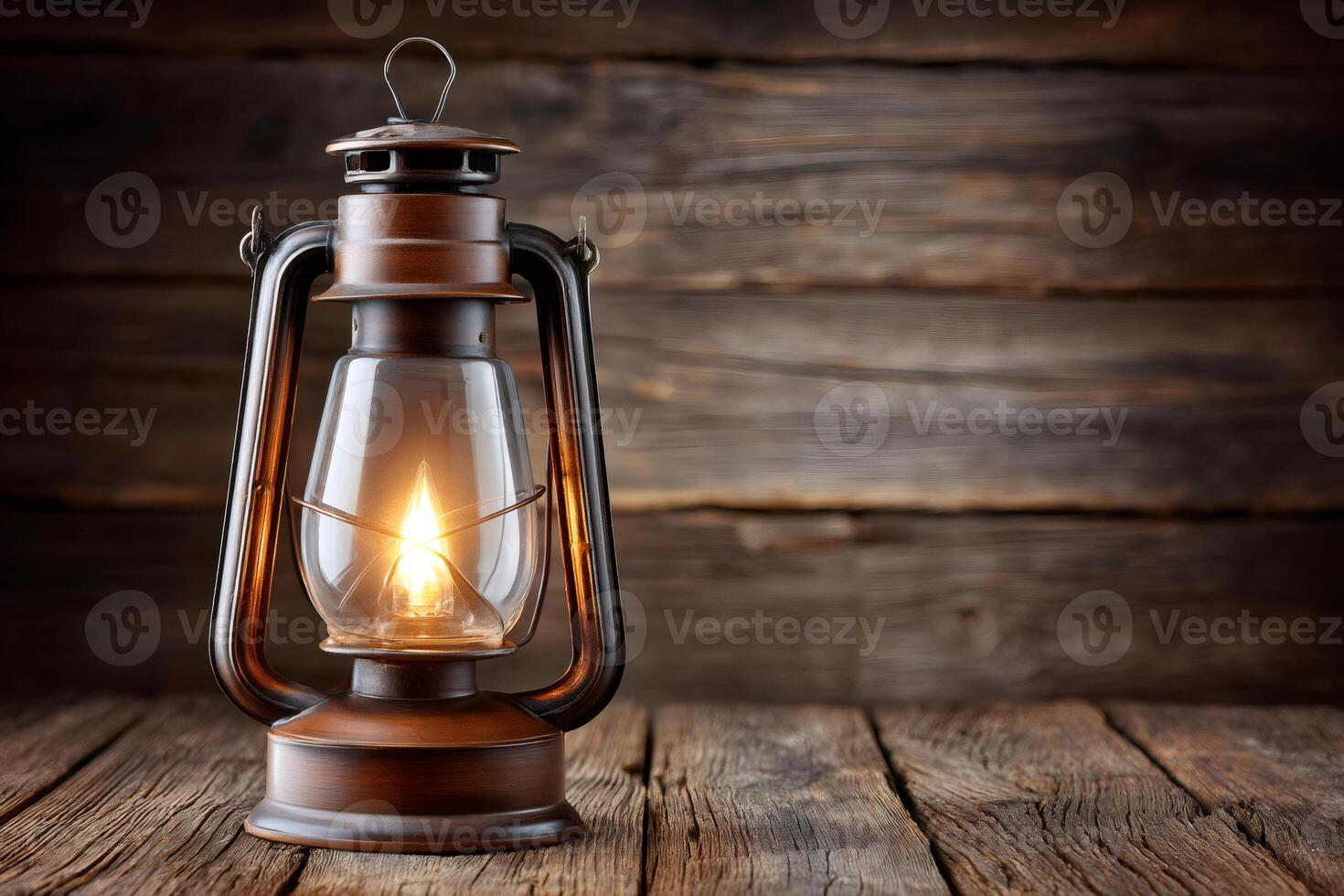 Burning oil lamp illuminating rustic wooden table in a moody setting photo