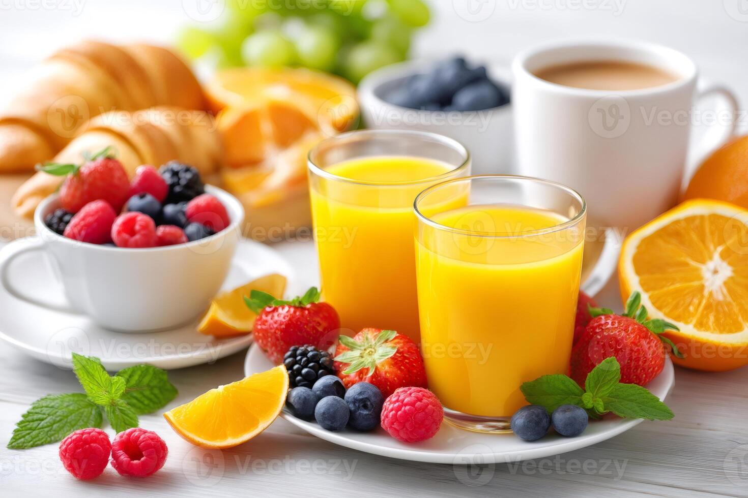 Delicious continental breakfast with croissant, berries, orange juice and coffee photo