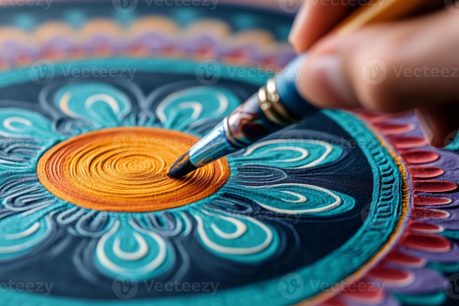 Artist painting colorful mandala with brush, creating traditional artwork photo