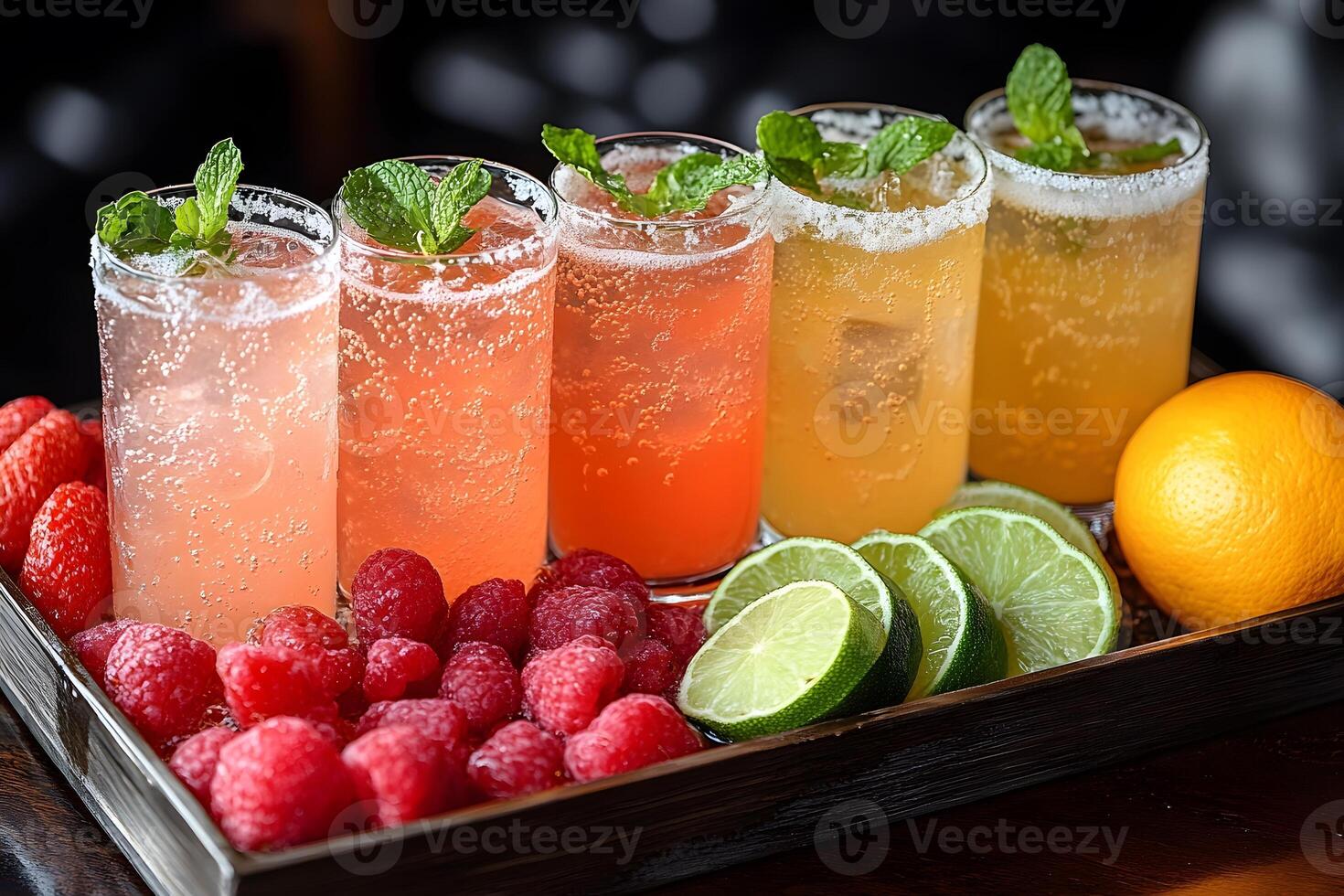 Refreshing Summer Cocktails with Citrus and Berries Garnished with Mint photo