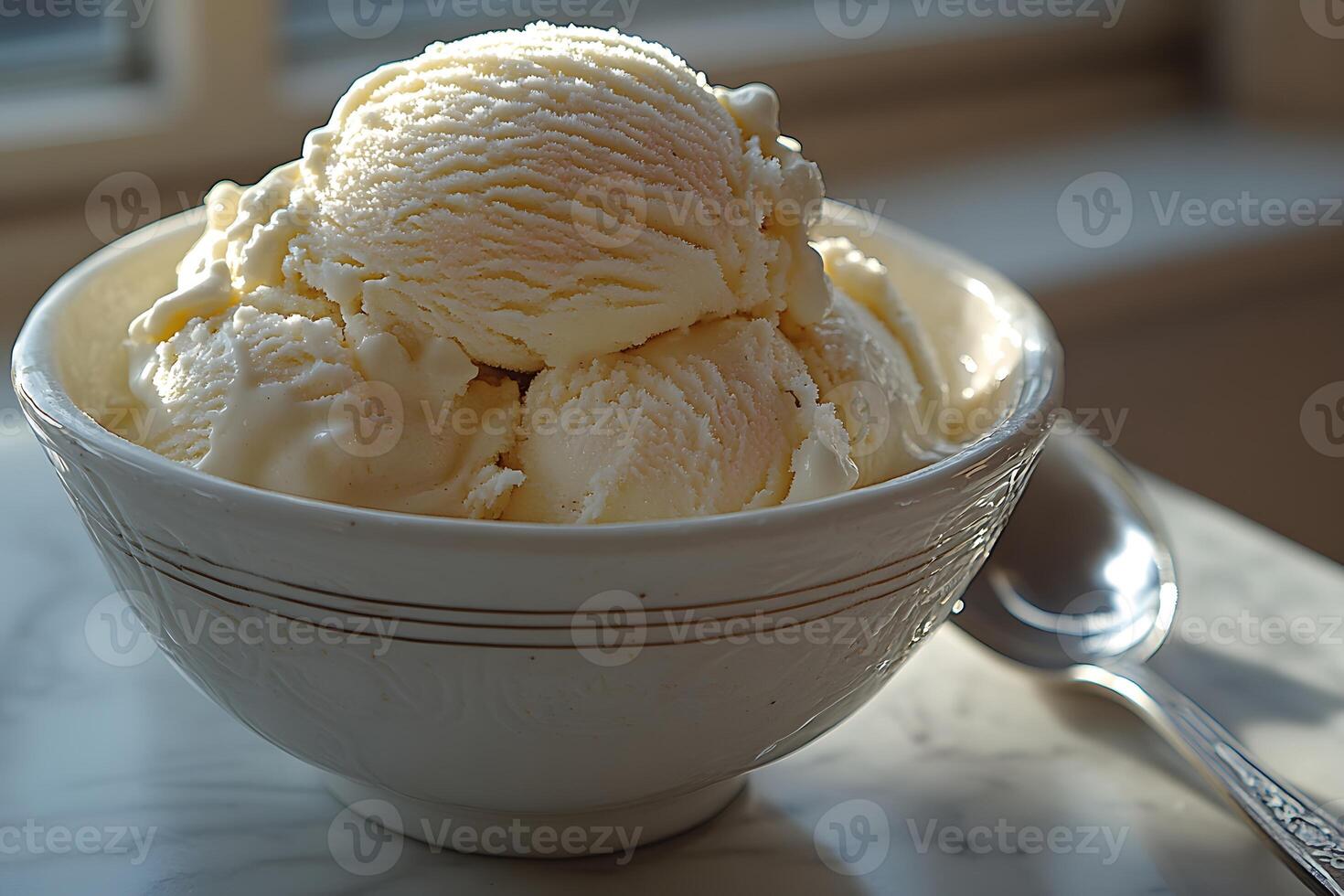 Creamy Vanilla Ice Cream in Sunlit Bowl Ideal for Summer Indulgence and Dessert Promotions photo
