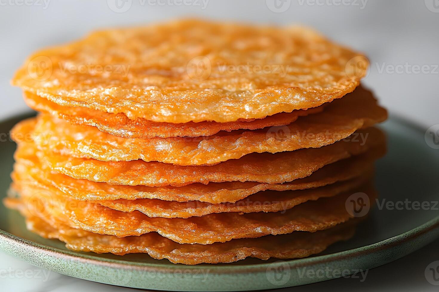 Stack of Crispy Rice Wafers on a Plate - Asian Snack Concept for Culinary Delight and Texture photo