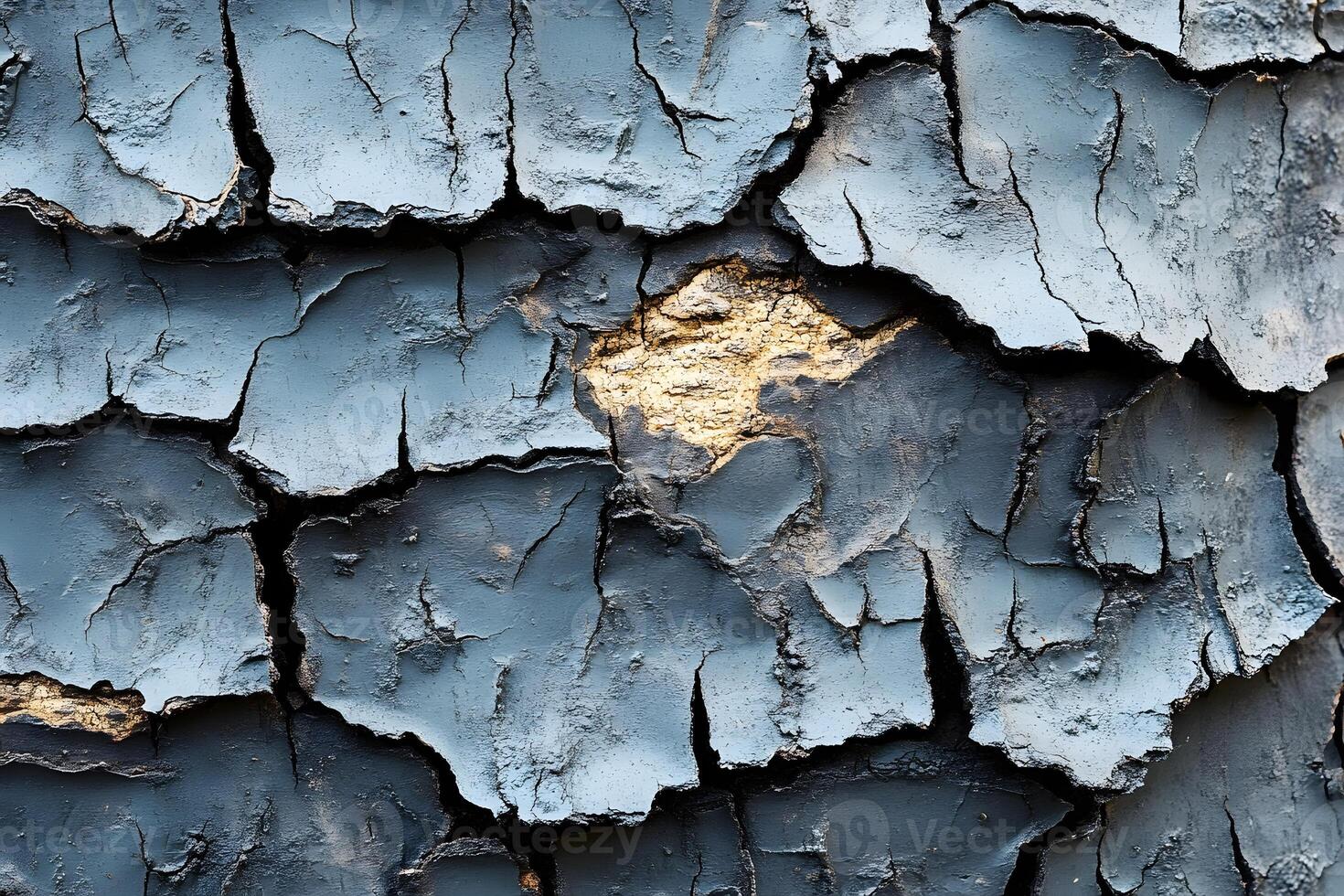 Textured Blue and Gold Cracked Paint Surface for Abstract Art and Design photo