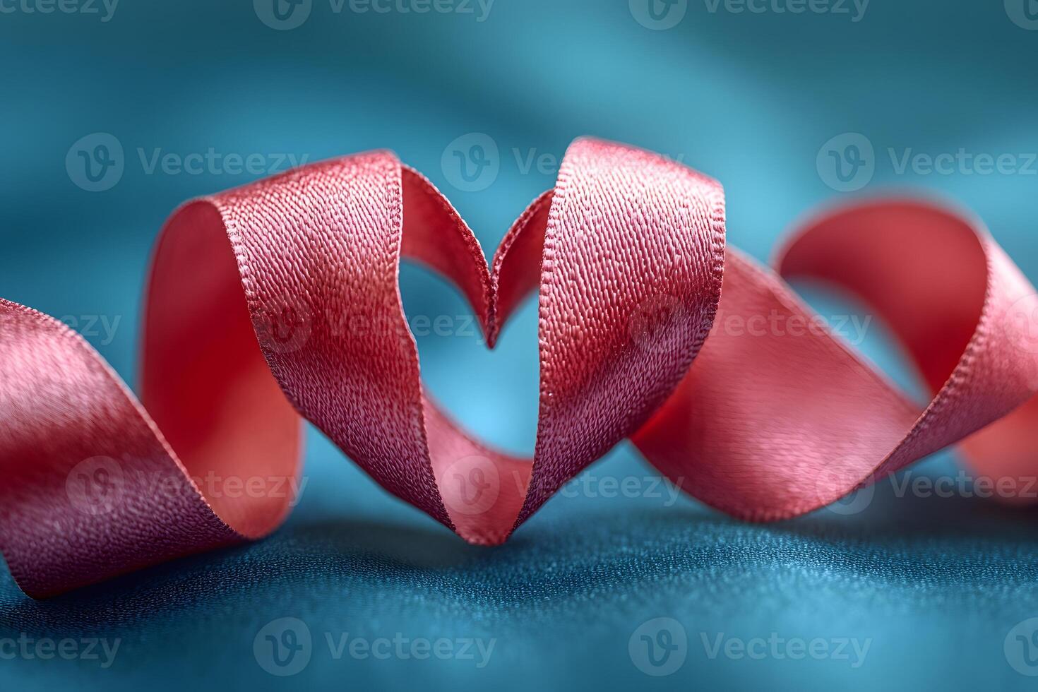 Romantic Pink Ribbon Heart Shape on Elegant Blue Silk for Valentine's Day Design photo