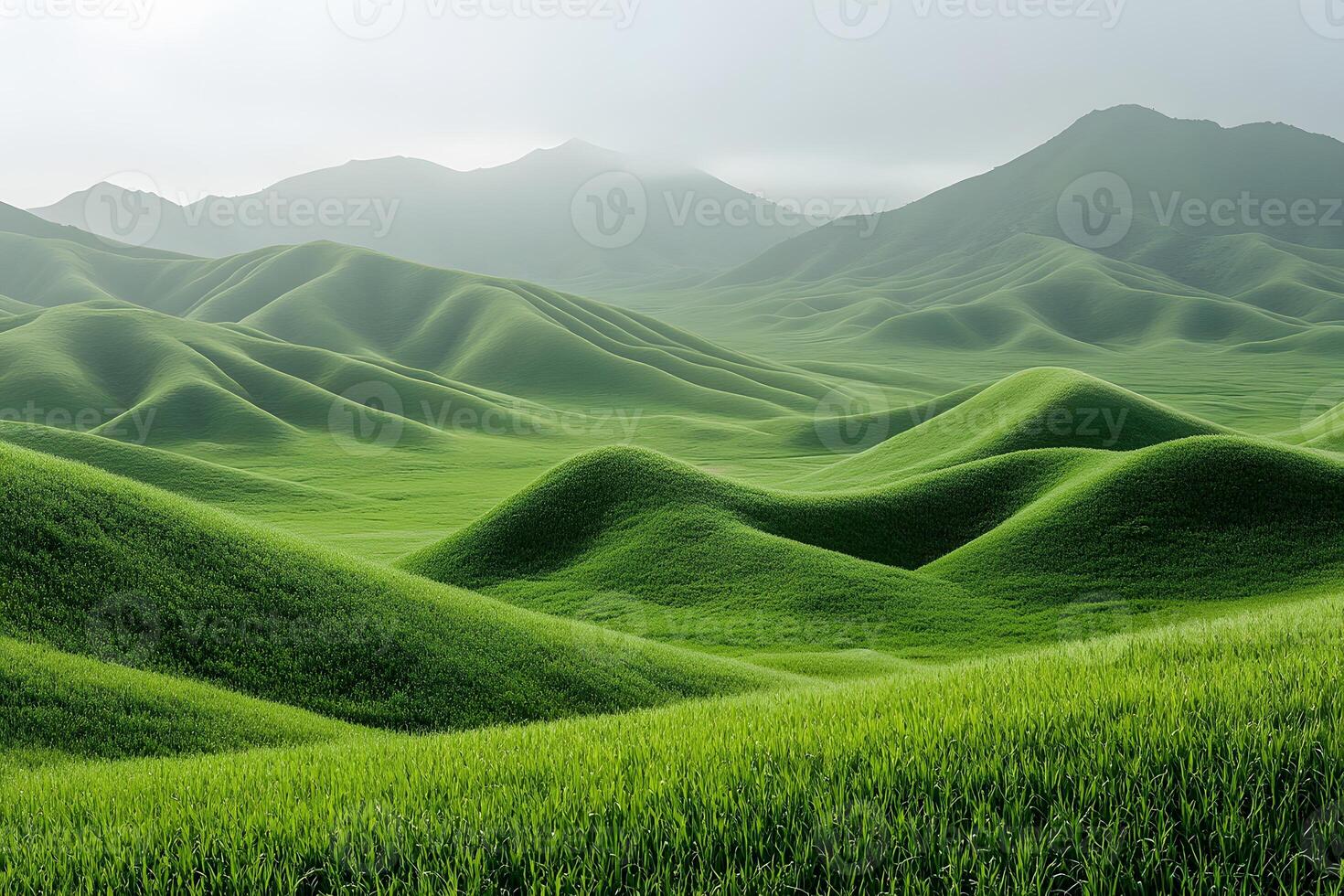 Serene Landscapes of Rolling Green Hills Under a Misty Sky photo