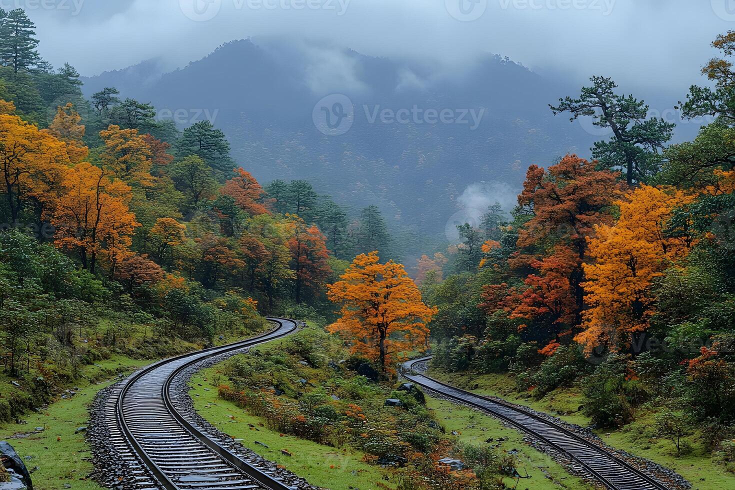 Autumn Railway Journey through Foggy Mountain Landscape for Scenic Travel and Nature Exploration photo