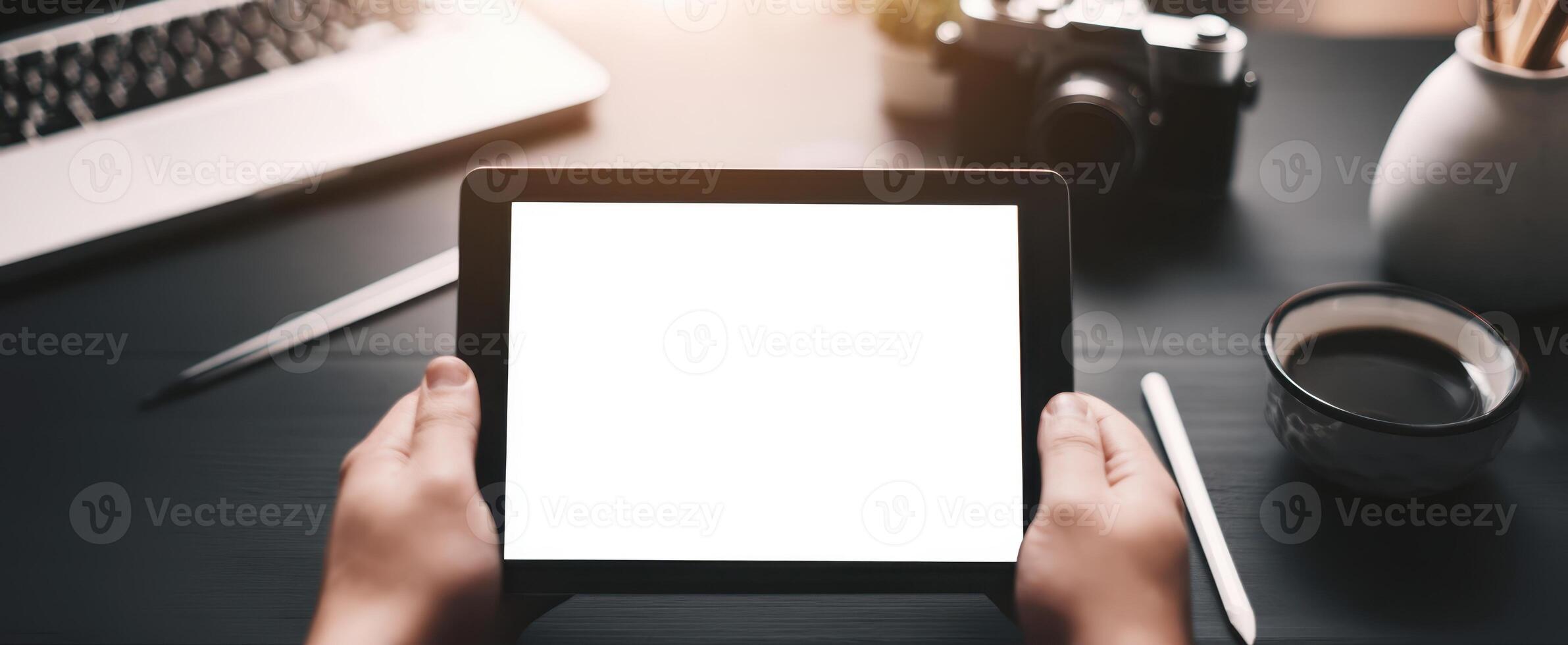 The modern tablet in hands ready for creative applications and digital projects. photo
