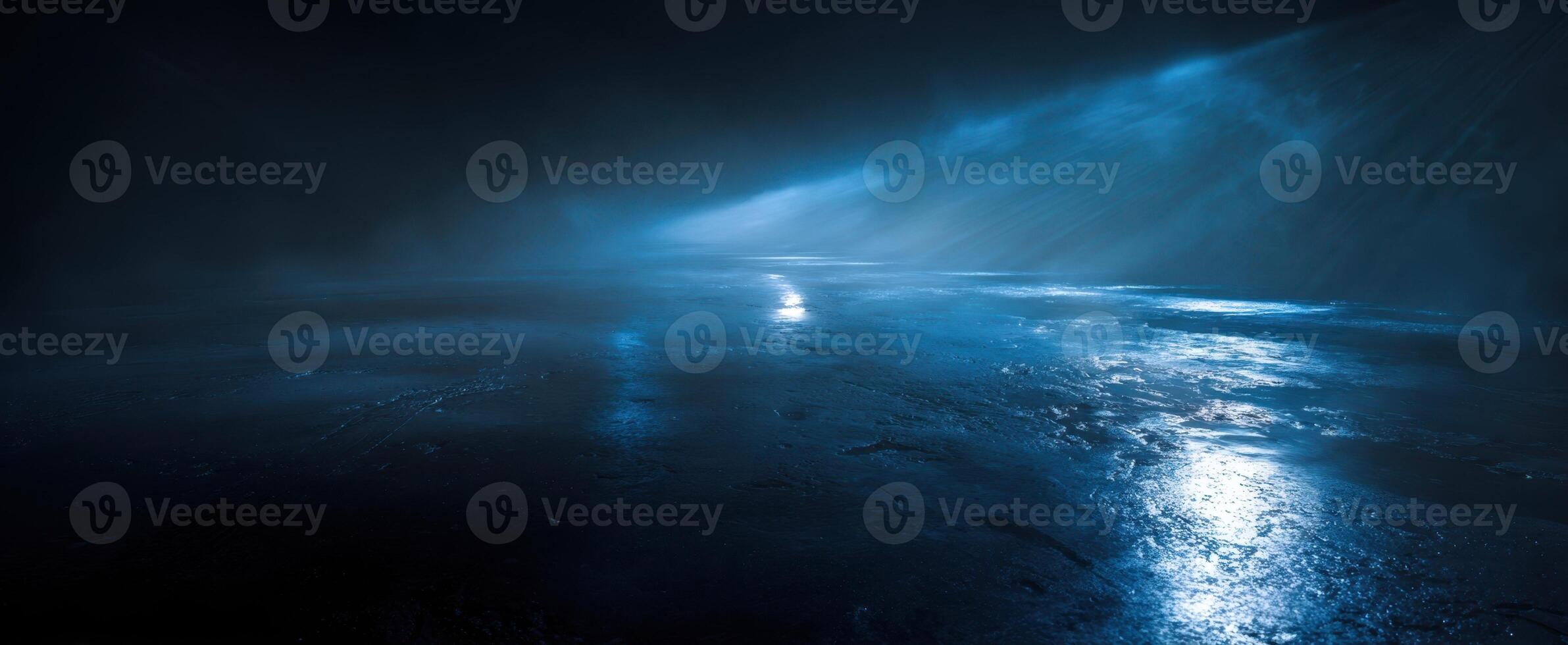 The mysterious blue landscape shrouded in fog and illuminated reflections. photo