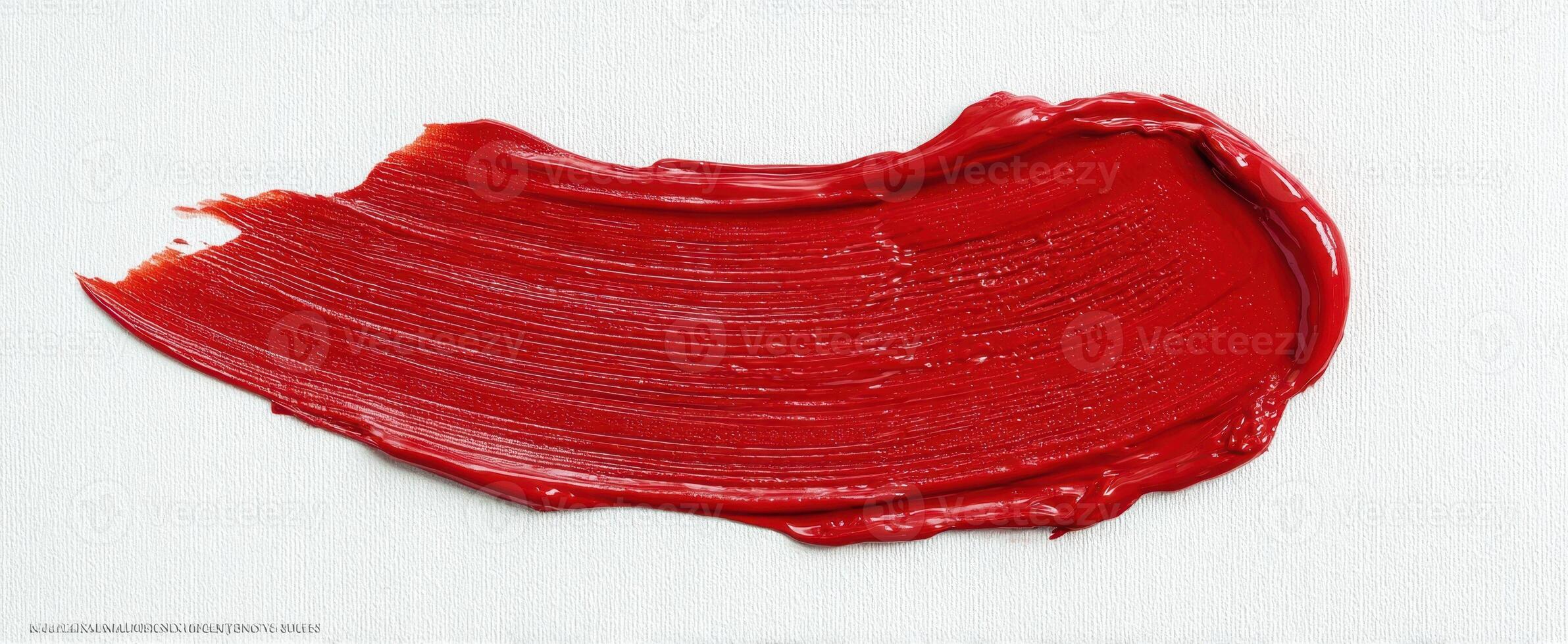 The red brushstroke showcasing vibrant artistry on a textured canvas. photo