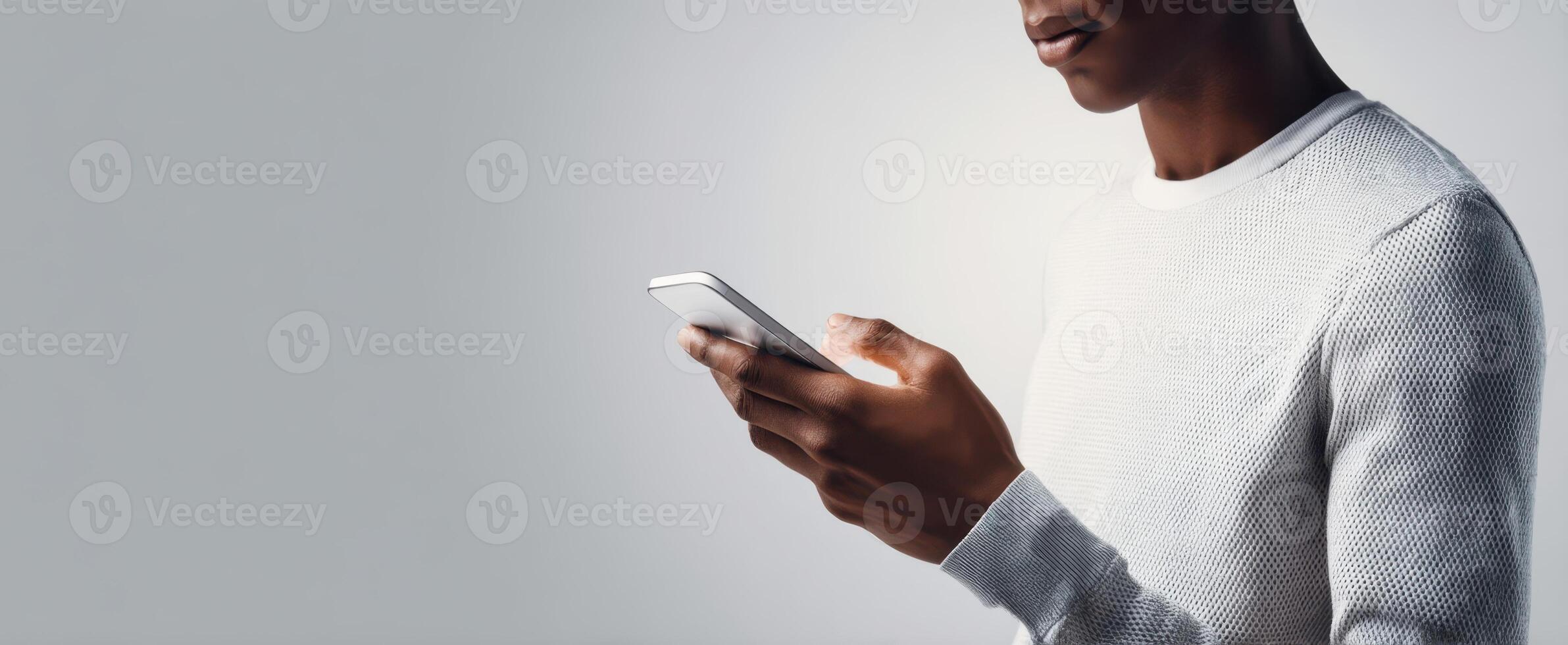 The person using a smartphone in a modern and casual setting. photo