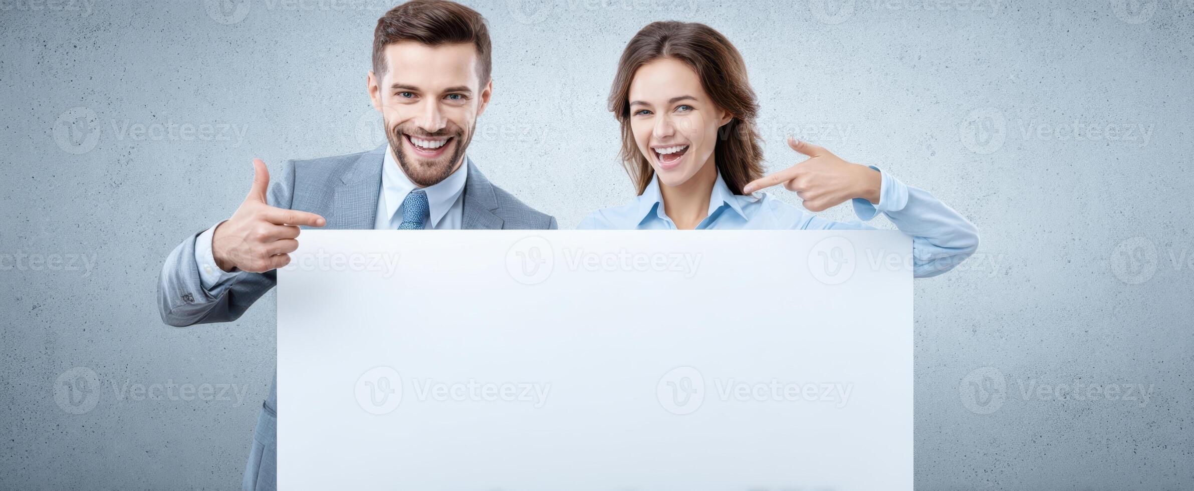 The smiling couple presenting a blank sign for advertising and marketing purposes. photo