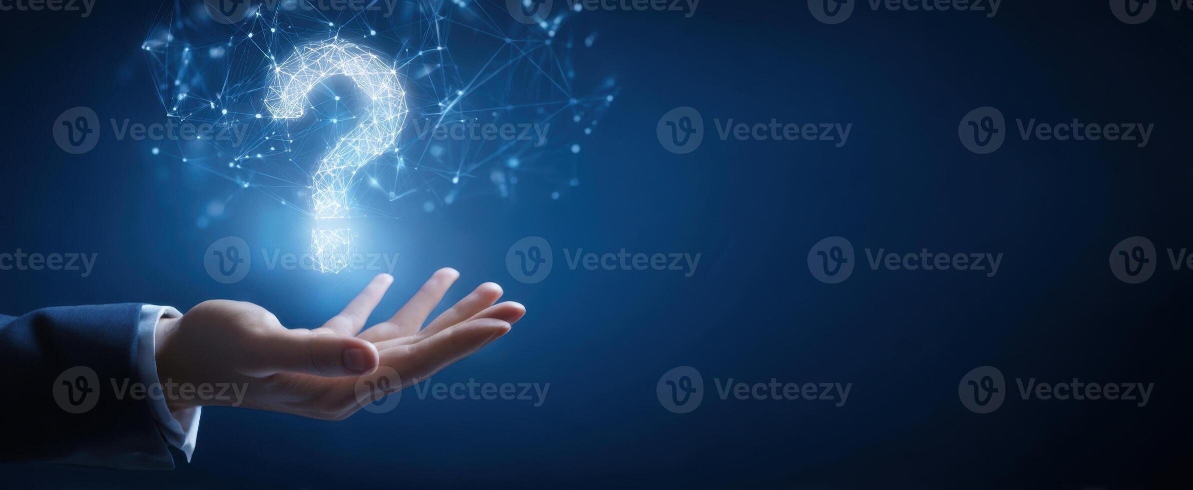 The Hand Holding a Glowing Question Mark Symbolizing Inquiry and Innovation photo