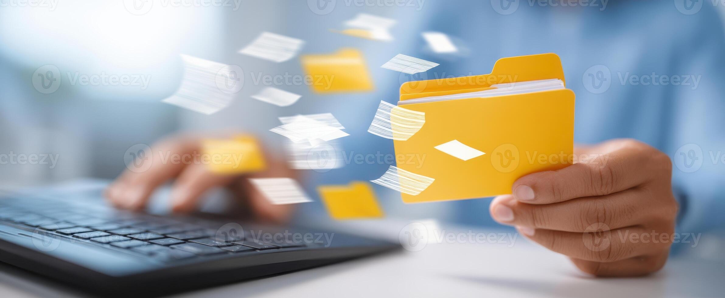 The folder being used to manage digital documents in a modern office. photo