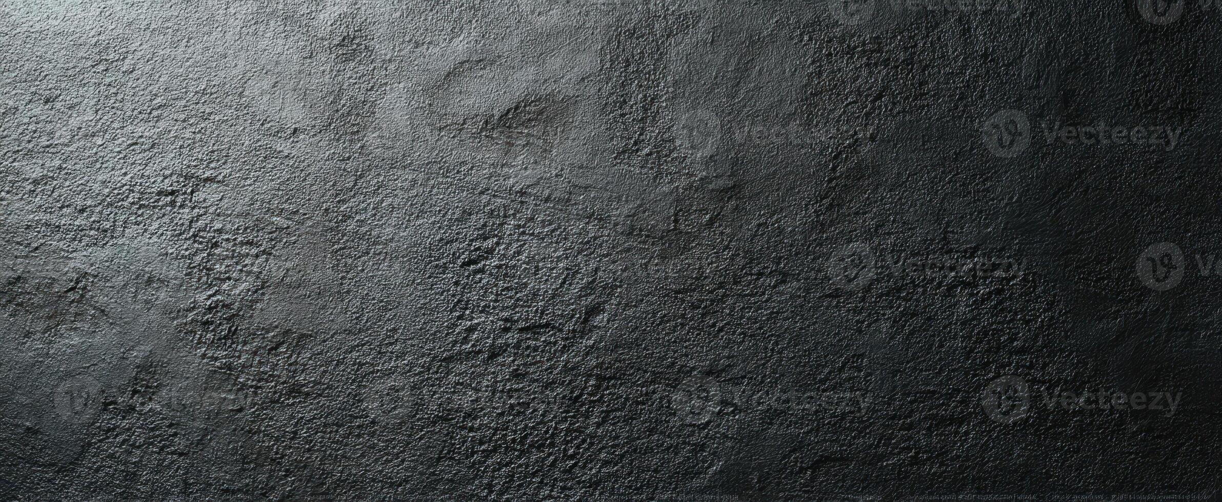 The textured dark surface with uneven patterns and modern aesthetic. photo