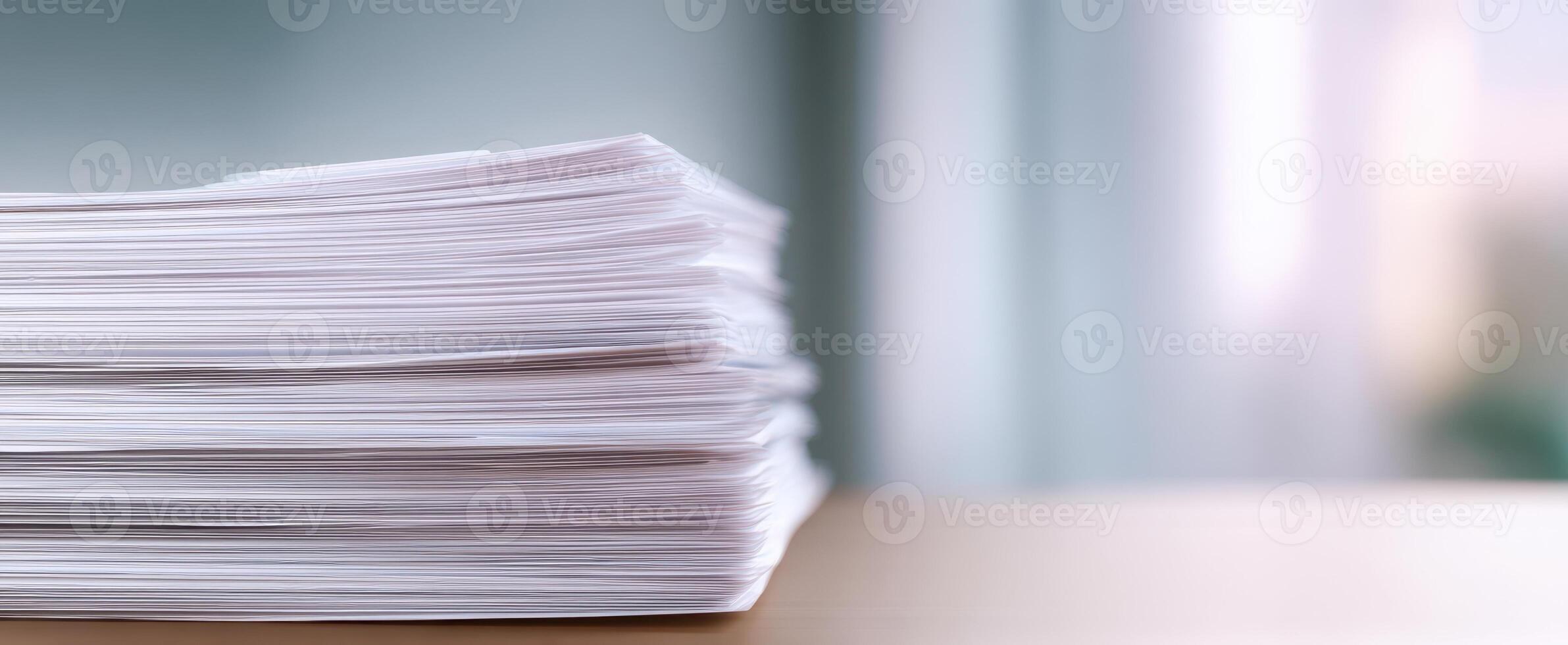 The neatly organized stack of paperwork on a modern desk environment. photo