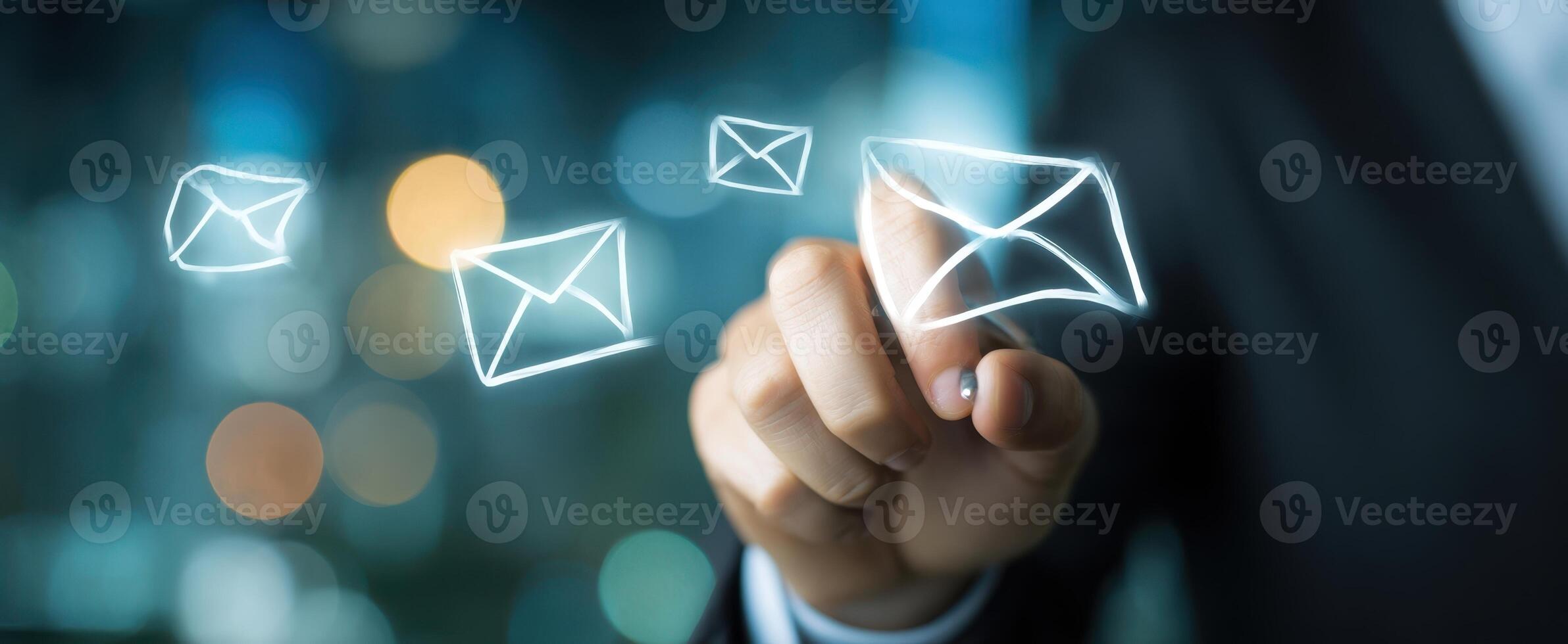 The innovative hand interacting with digital email notifications in a modern office. photo