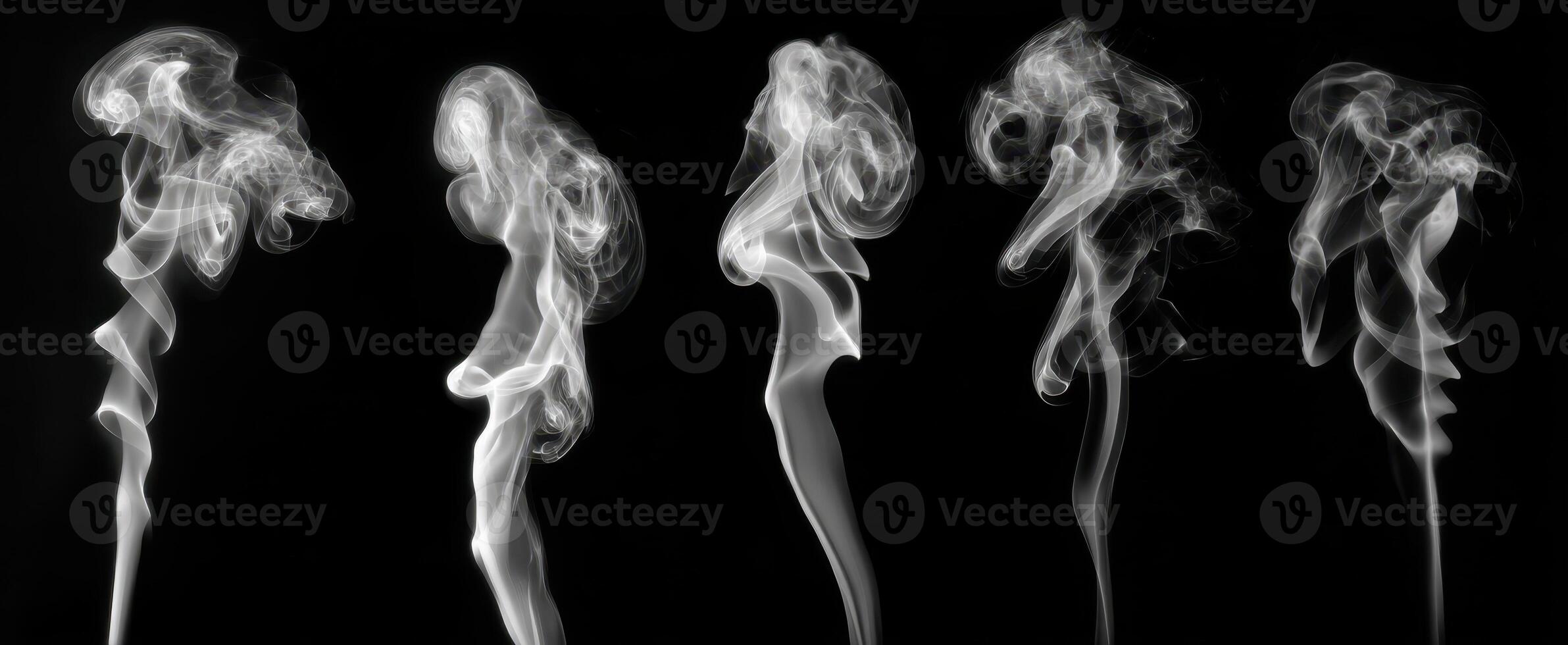 The captivating dance of smoke forming abstract shapes on a dark background. photo