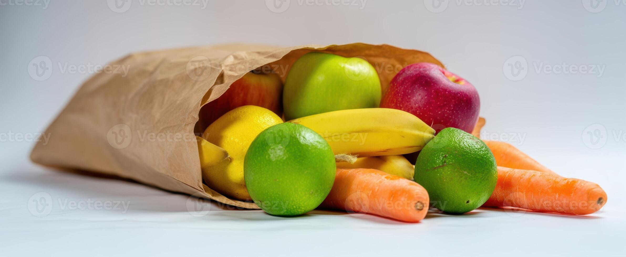 The colorful assortment of fruits and vegetables spilling from a brown paper bag. photo