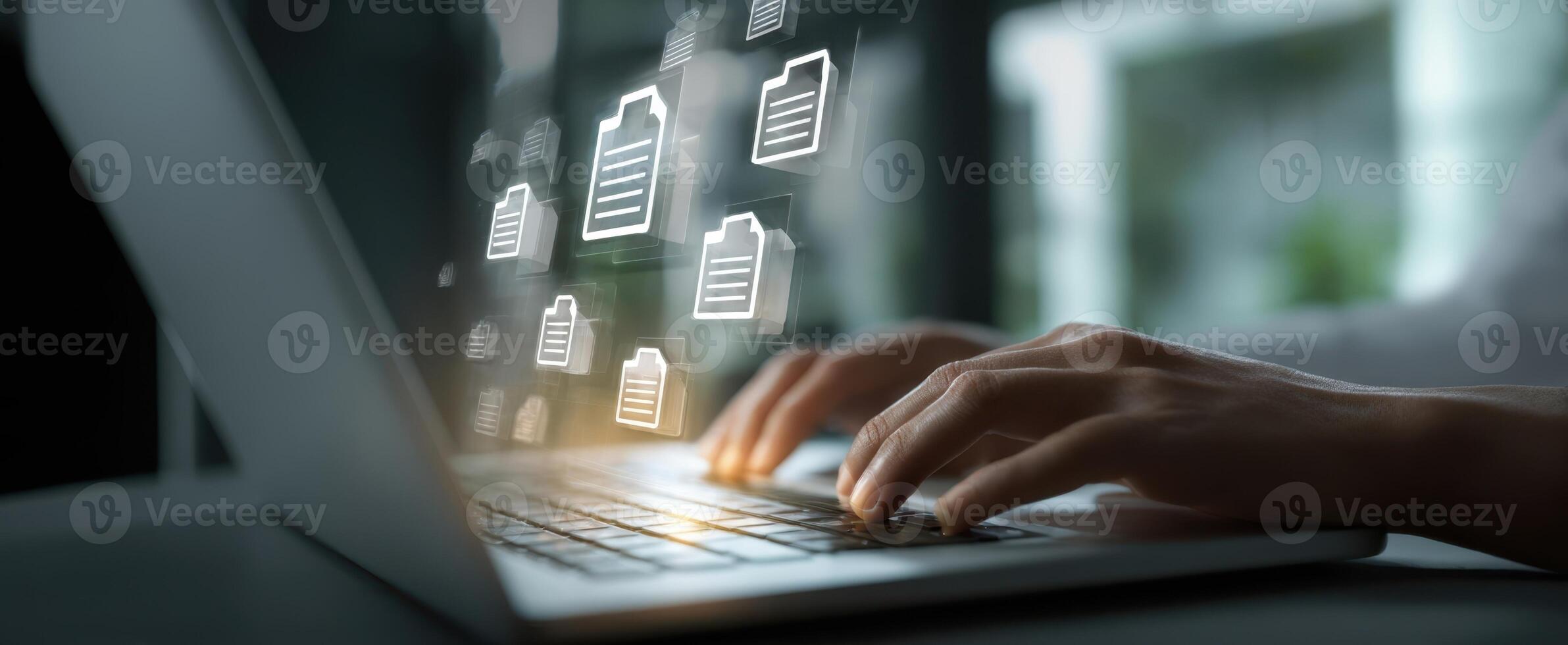 The digital workspace with hands typing on a laptop and floating file icons photo