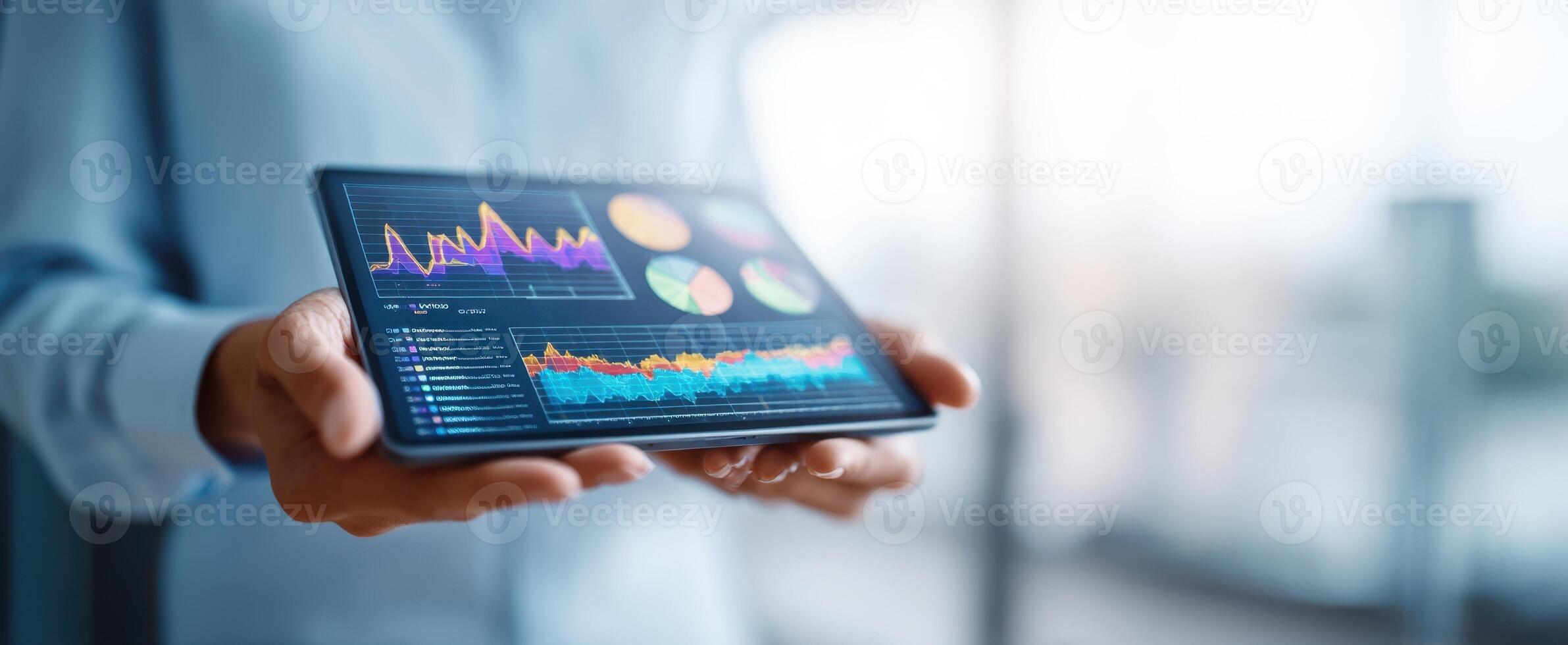 The tablet displaying colorful graphs and analytics for business insights. photo