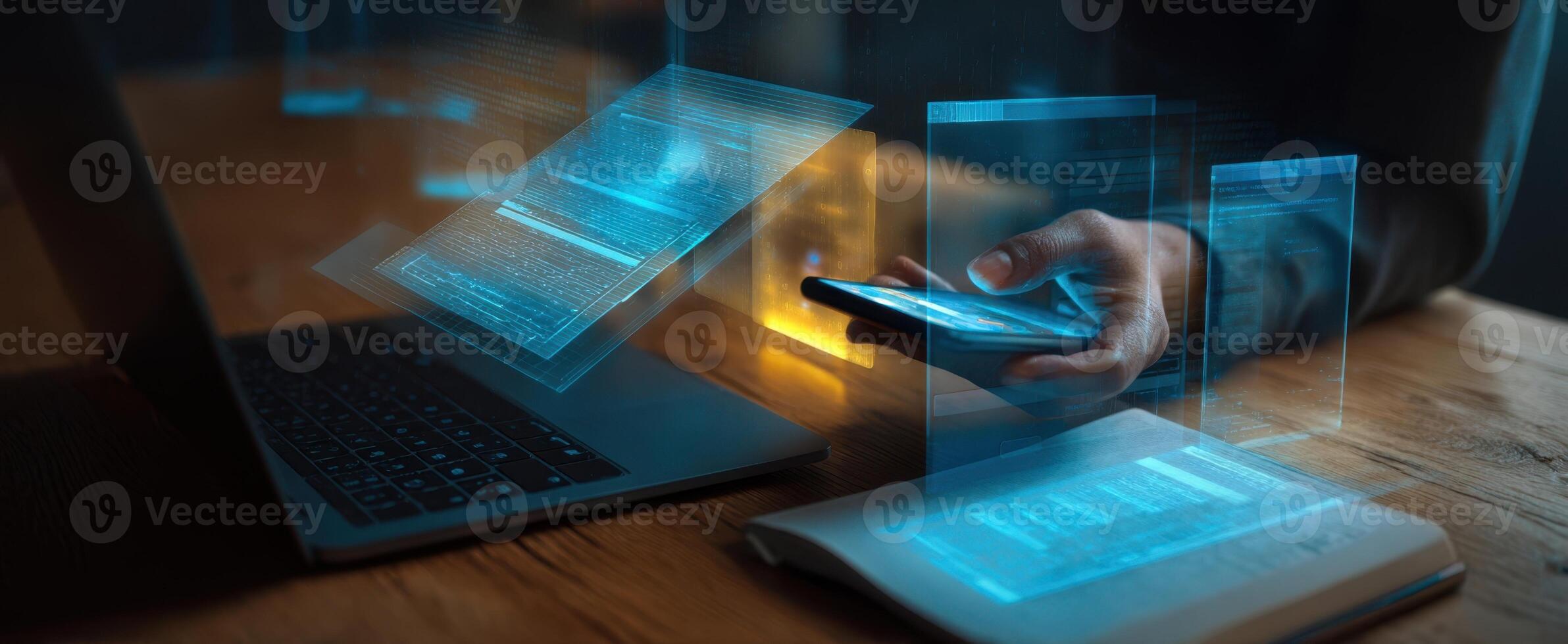 The modern workspace featuring a smartphone and laptop with digital holograms. photo