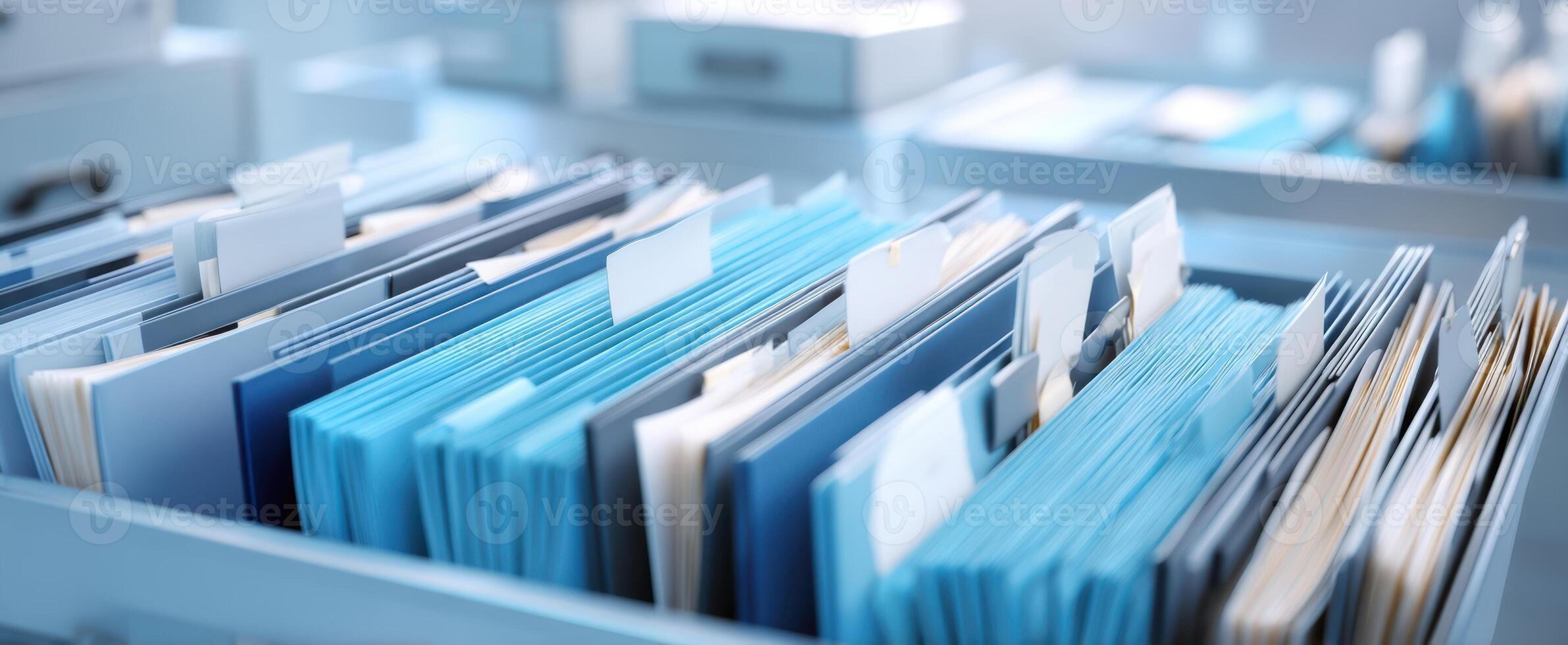 The organized collection of blue files in a modern office setting. photo