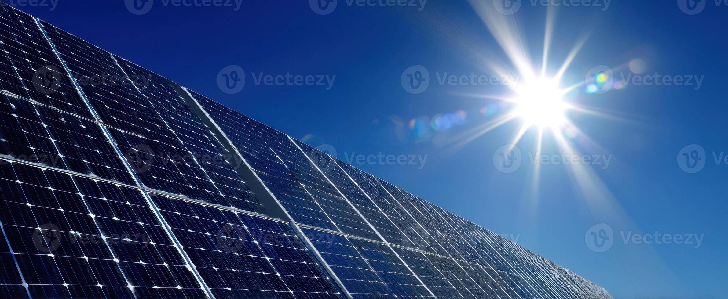The solar panels capturing sunlight in a vibrant blue sky. photo