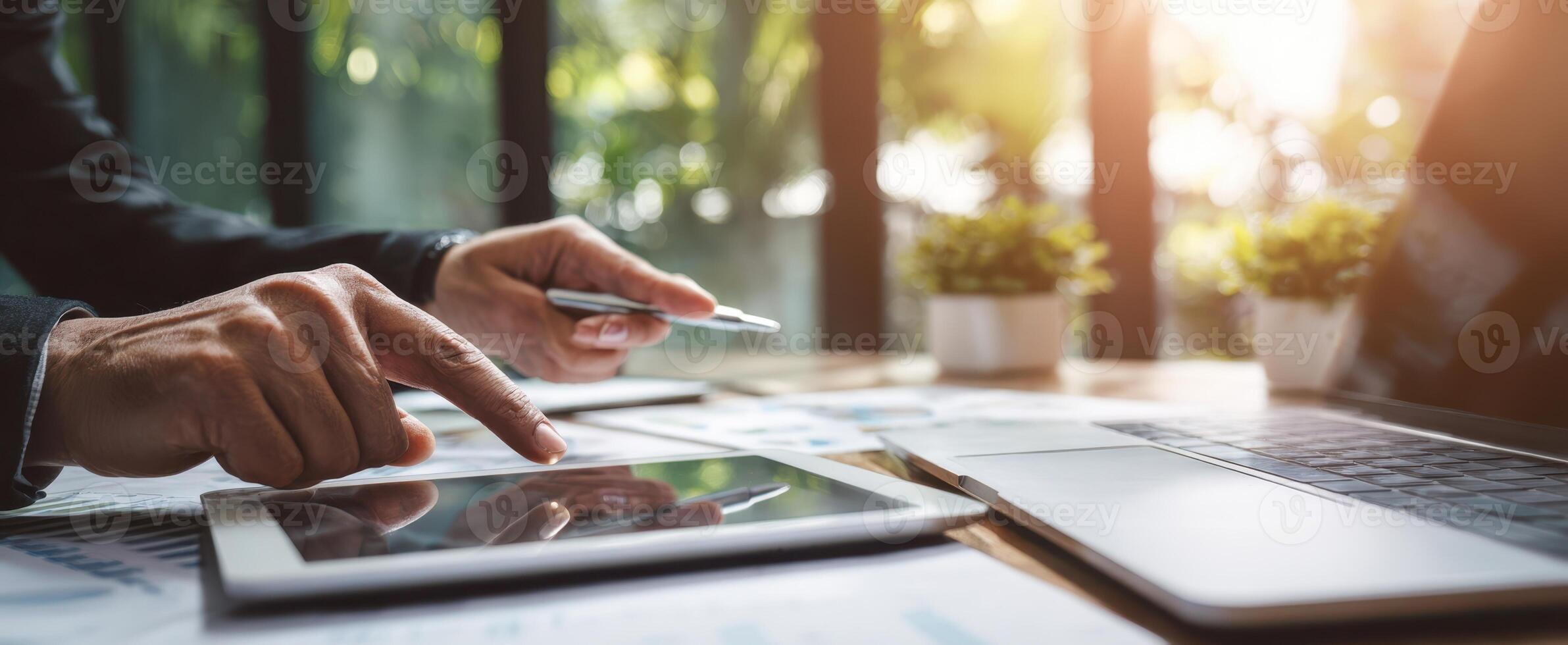 The modern workspace with tablet and laptop in a professional setting. photo