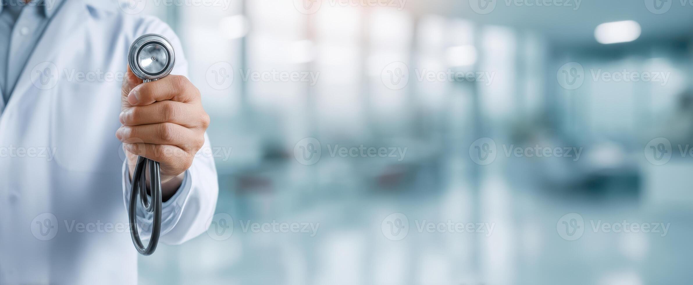 The doctor holding a stethoscope ready for patient consultation in modern clinic. photo