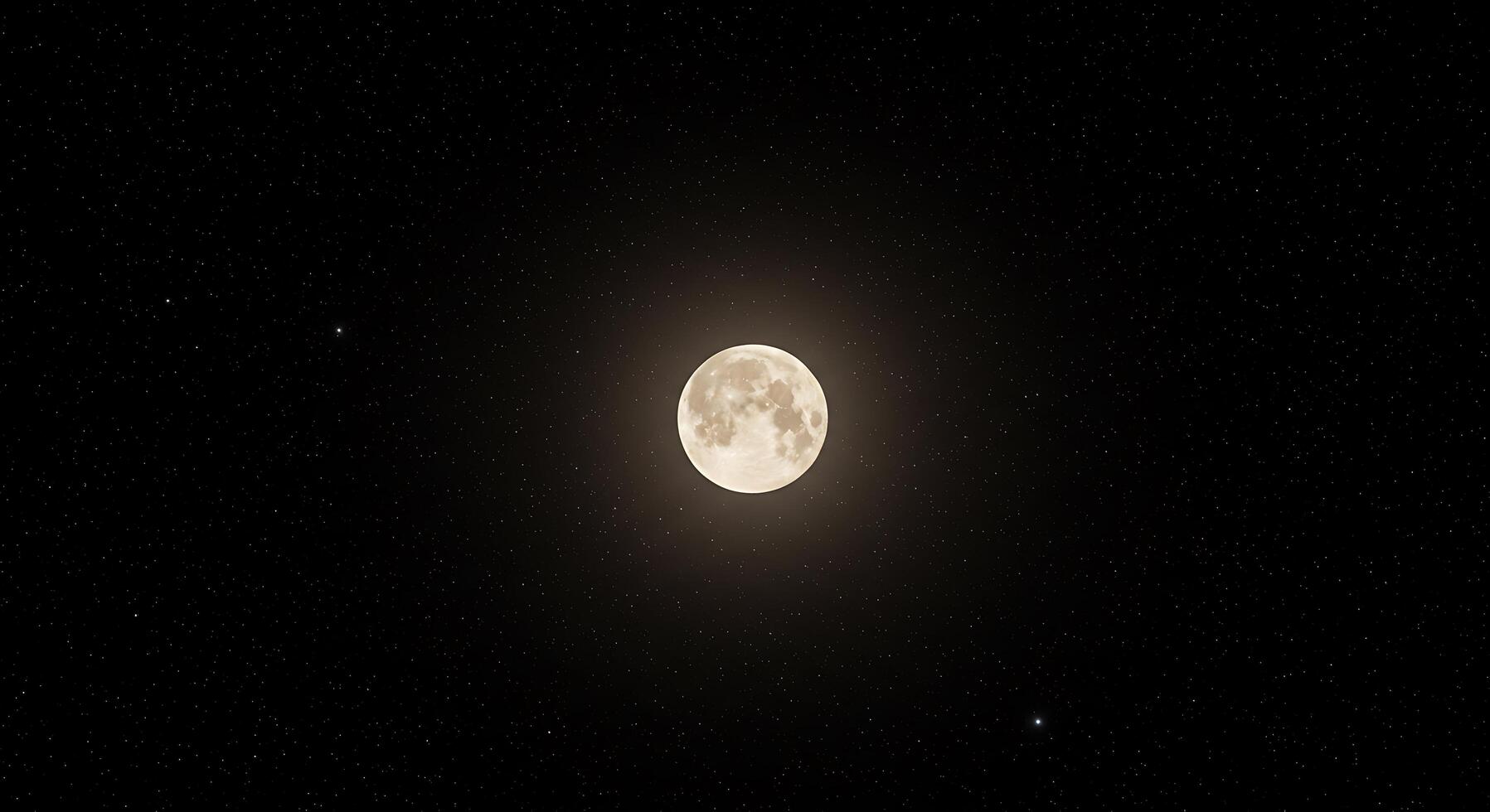 A full moon is seen in the dark sky photo