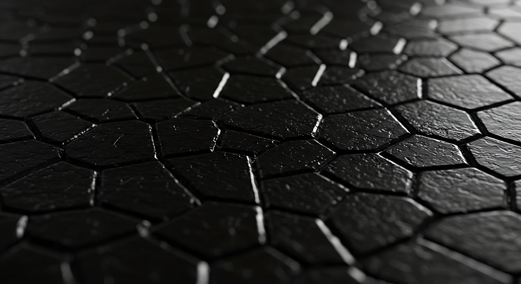 A black surface with a pattern of cracks photo