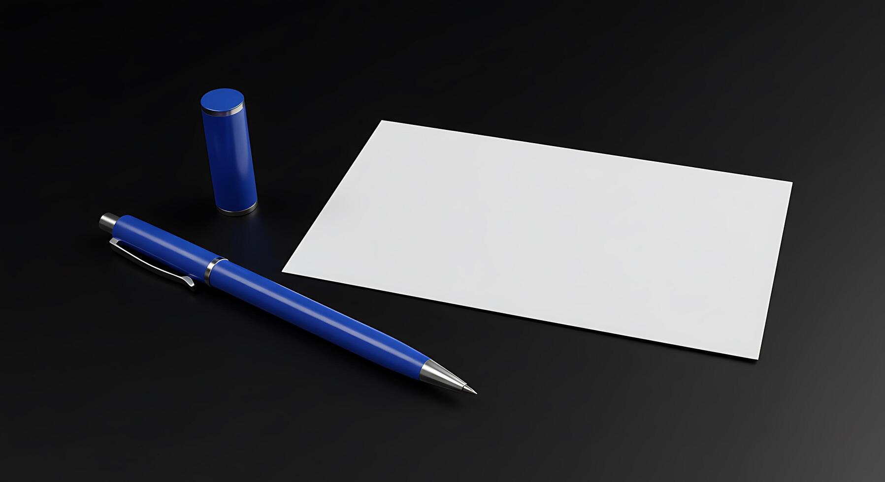 A white sheet of paper and a blue pen on a black surface photo
