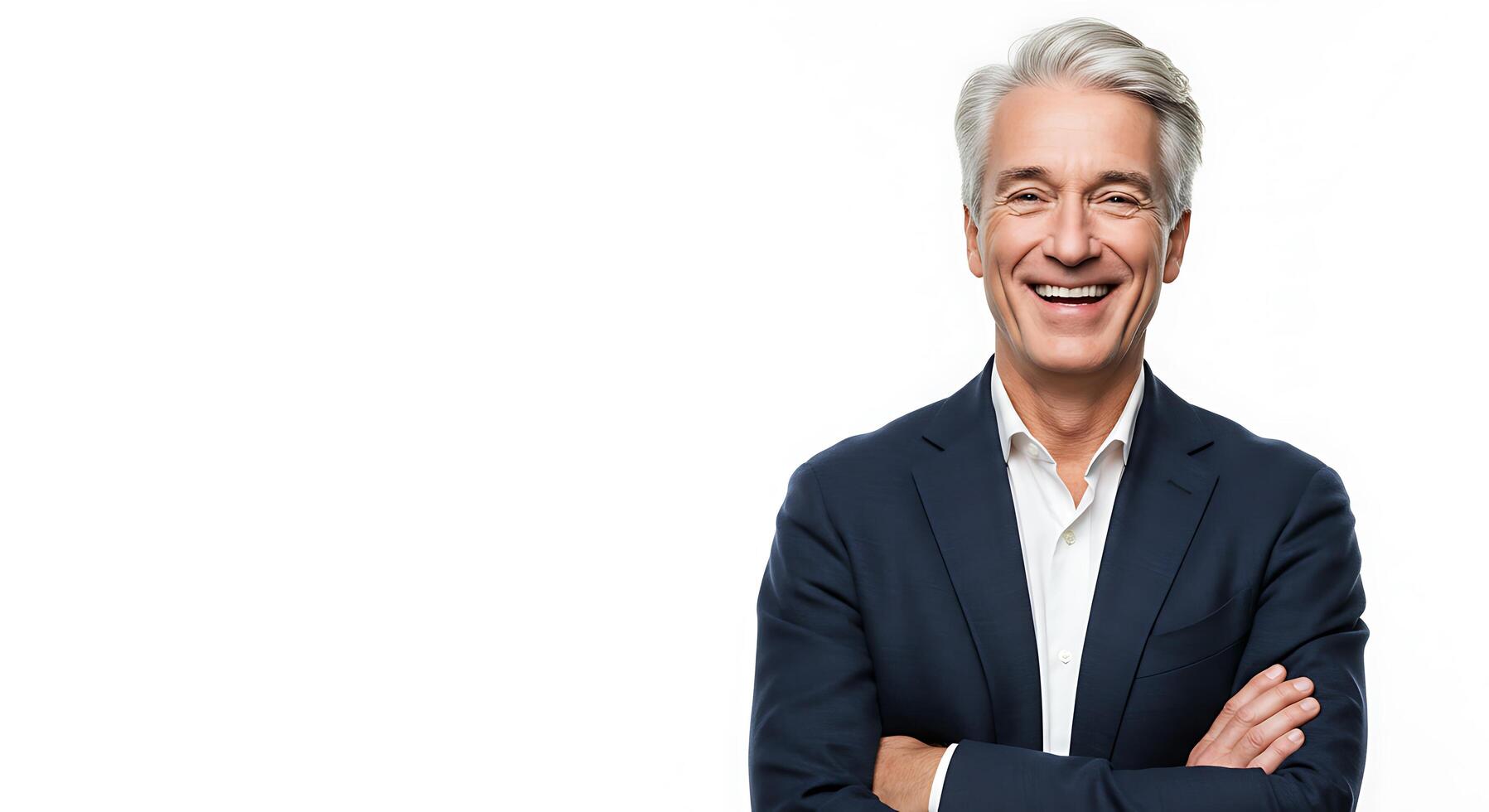 A man with gray hair and a suit is smiling photo