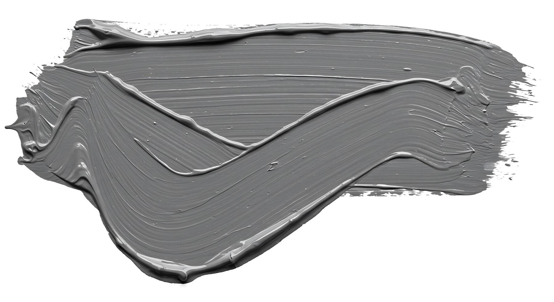 A gray paint brush is being used to paint a wall photo
