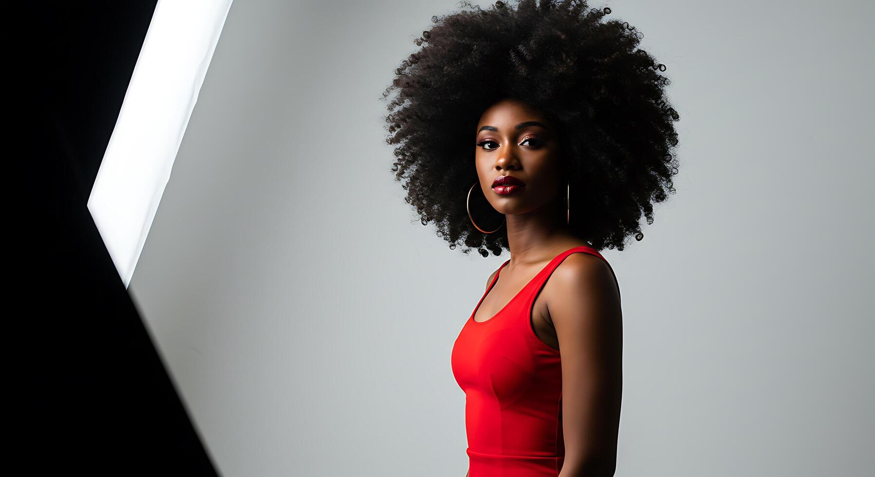 A woman with an afro in a red dress photo