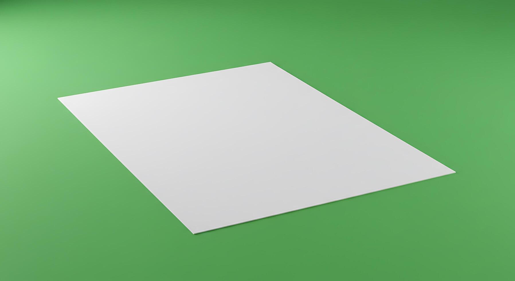 Blank paper on a green background photo