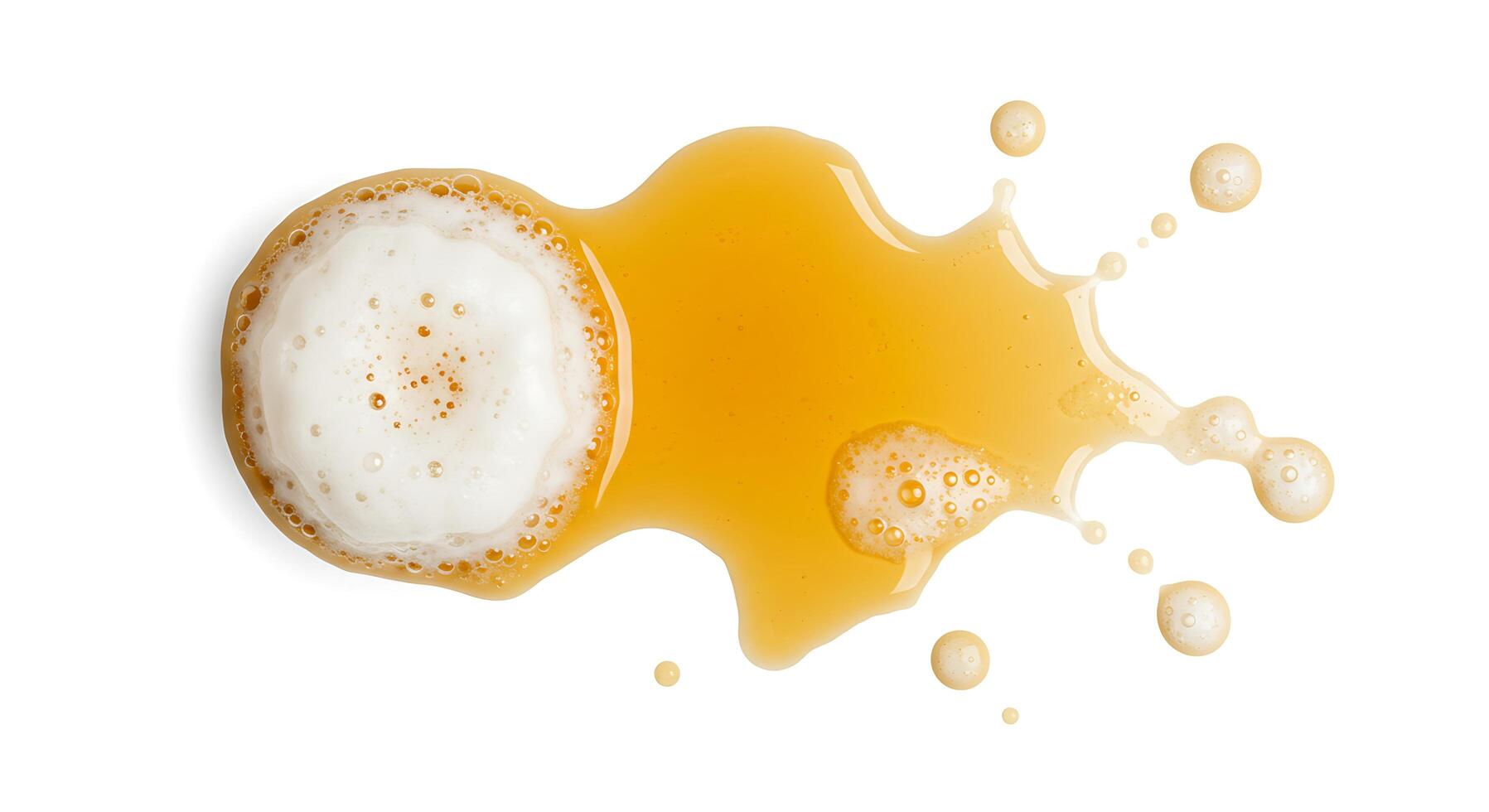 An orange liquid is being poured into a glass photo