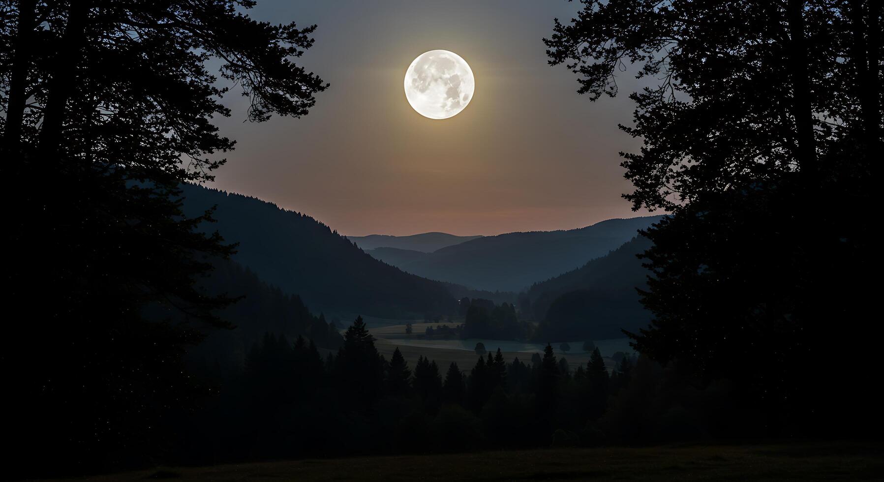 A full moon is seen over a valley with trees photo