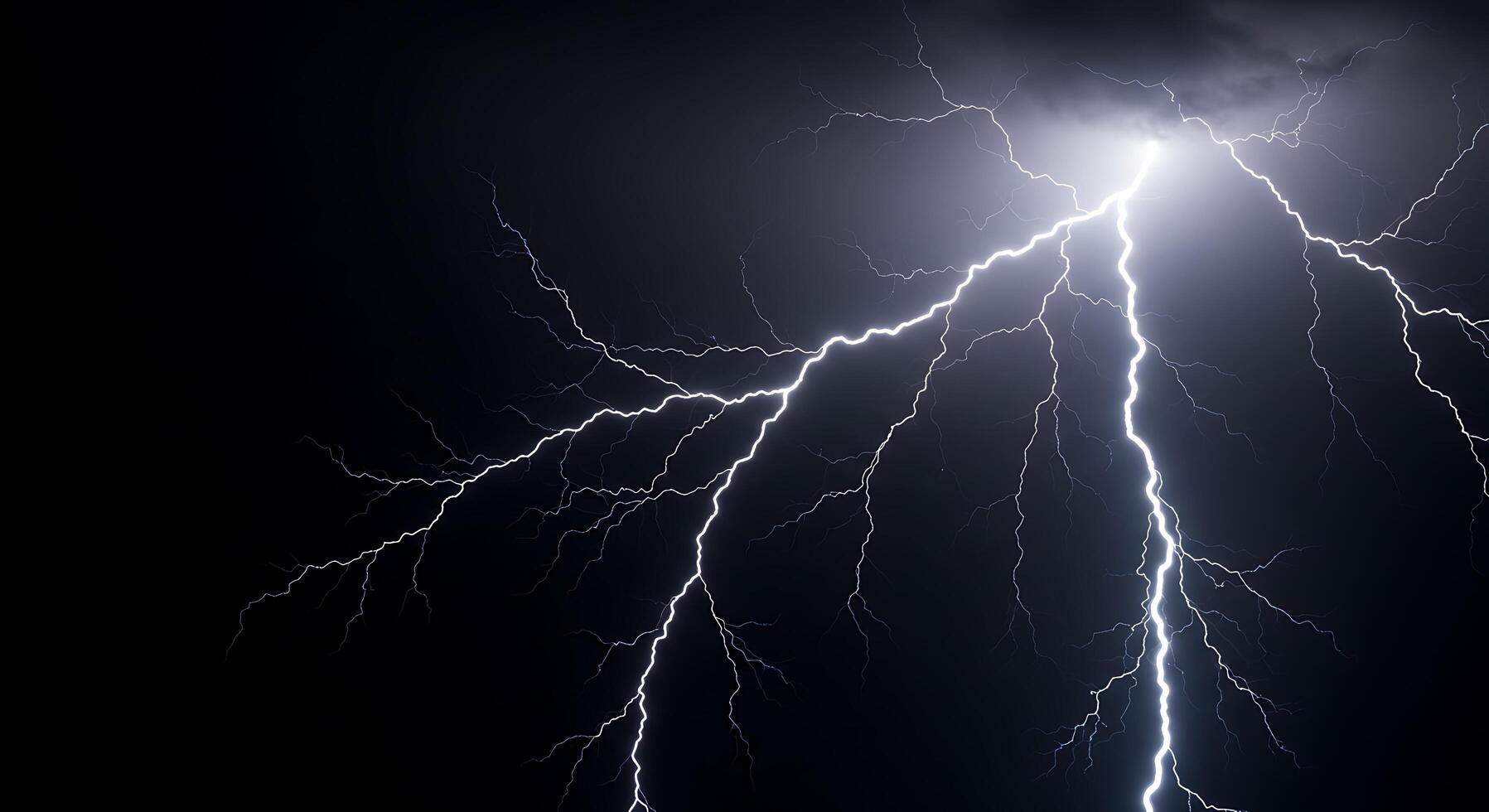 Lightning bolt striking the dark sky photo