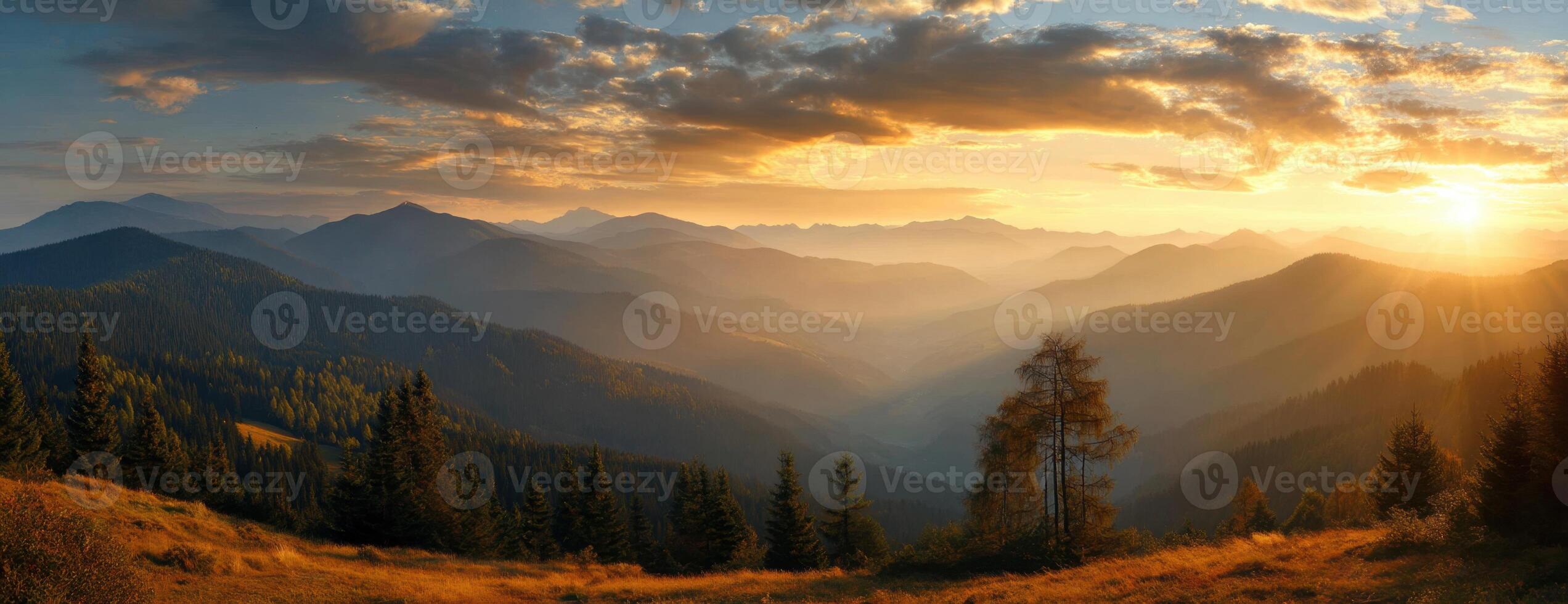 Picturesque mountain landscape panorama during sunset with golden light across vast valleys photo
